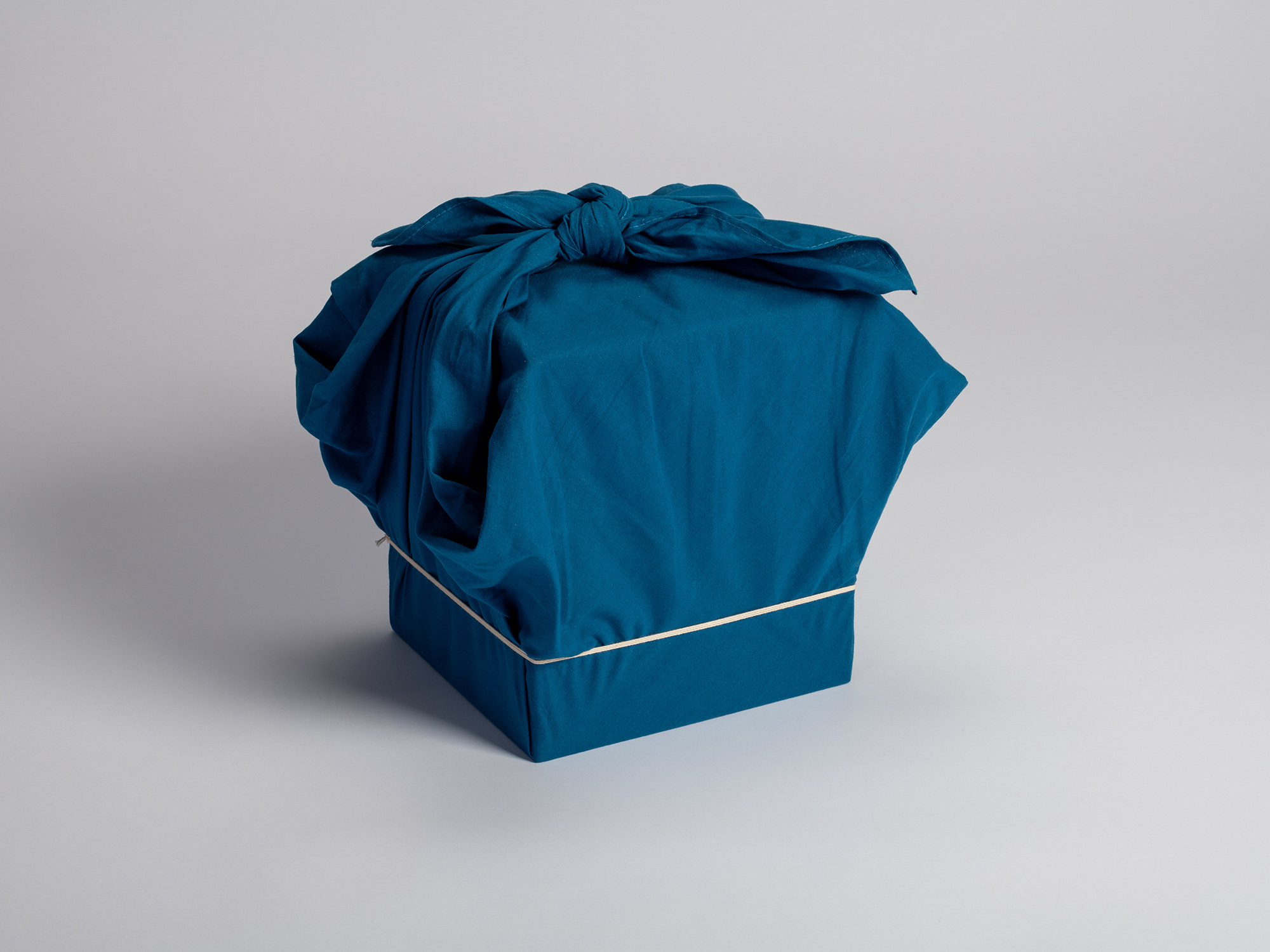 Protective outer storage box housing the tea bowl Musashino by Raku I Chōjirō, wrapped in a deep...