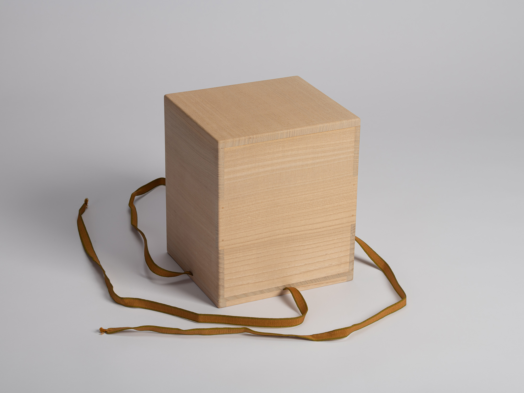 Closed kiri-wood storage box for the tea bowl Musashino by Raku I Chōjirō, shown without its protective...