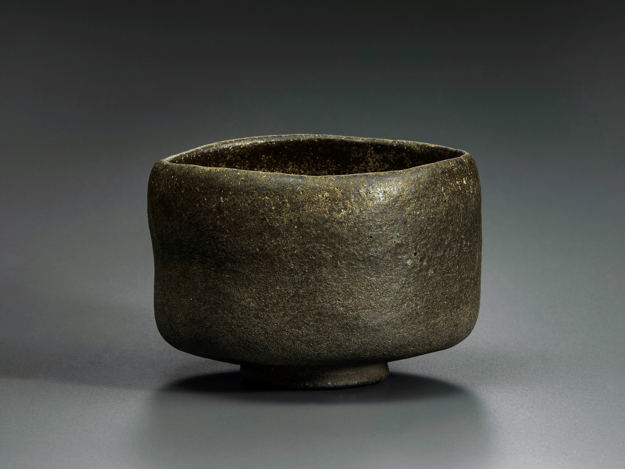 Raku tea bowl entitled Musashino by Chōjirō, a hand-formed black chawan with thick rounded walls...