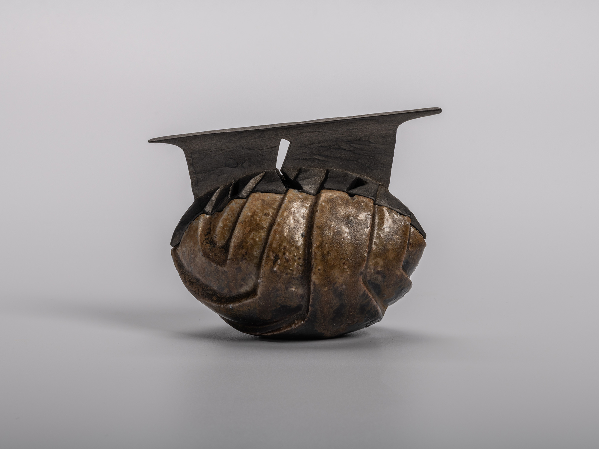 Abstract Black Incense Burner (kōro) by Bizen ceramic artist Ryuichi Kakurezaki. The piece features...