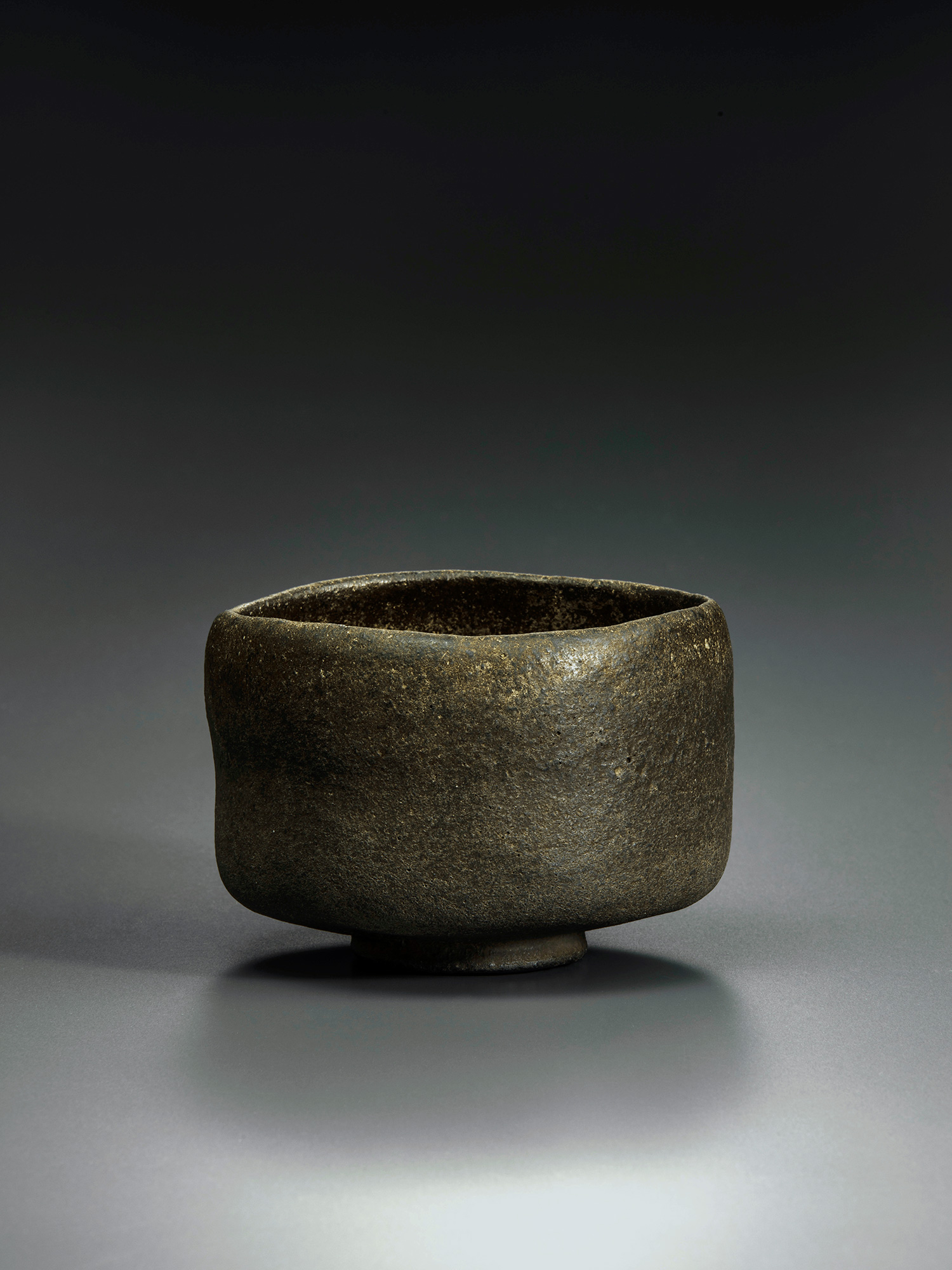Raku tea bowl entitled Musashino by Chōjirō, a hand-formed black chawan with thick rounded walls...