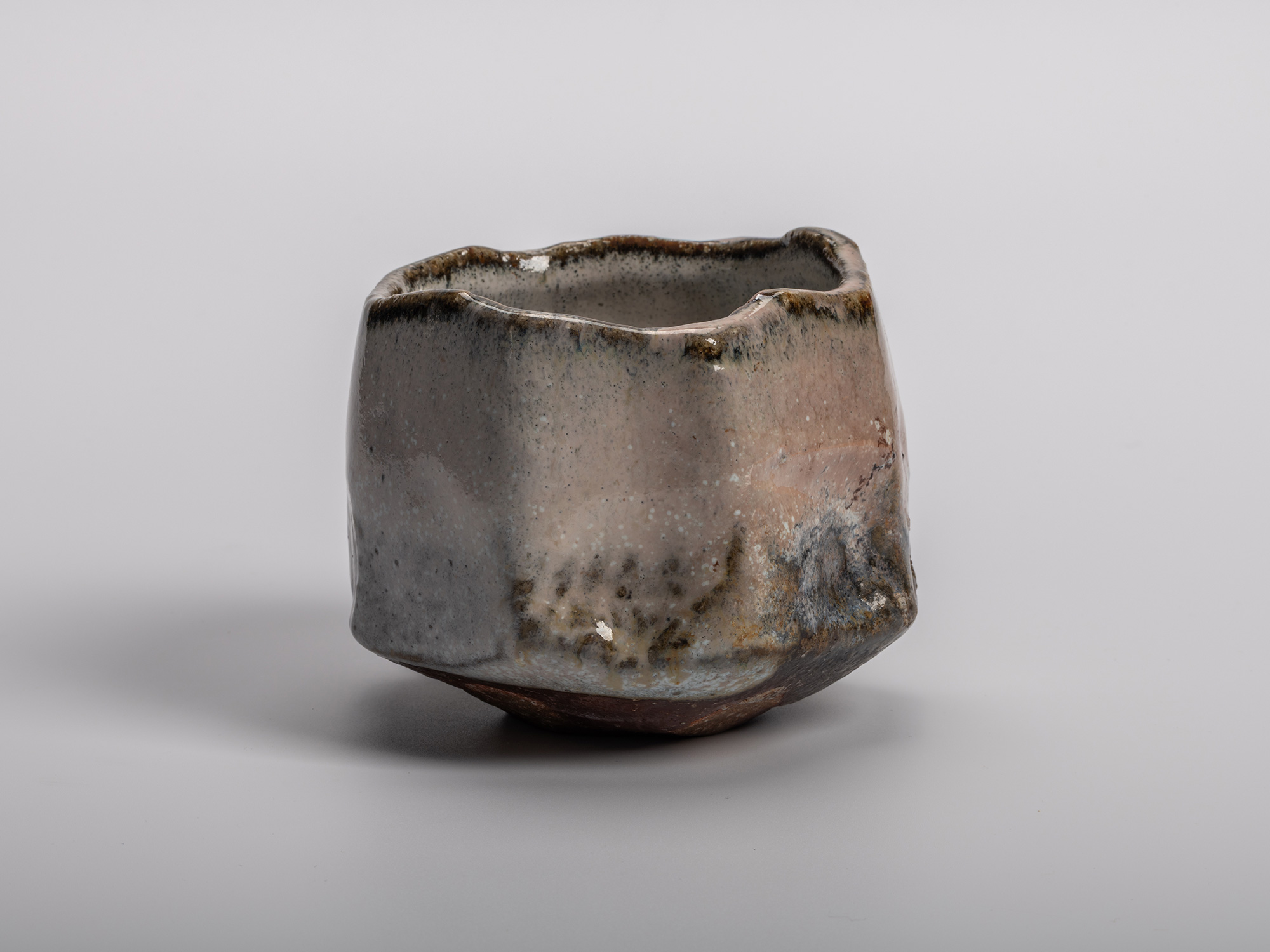 Masanao Kaneta’s Haikaburi Kurinuki tea bowl with hand-carved form, soft ash-fired glaze in gray...
