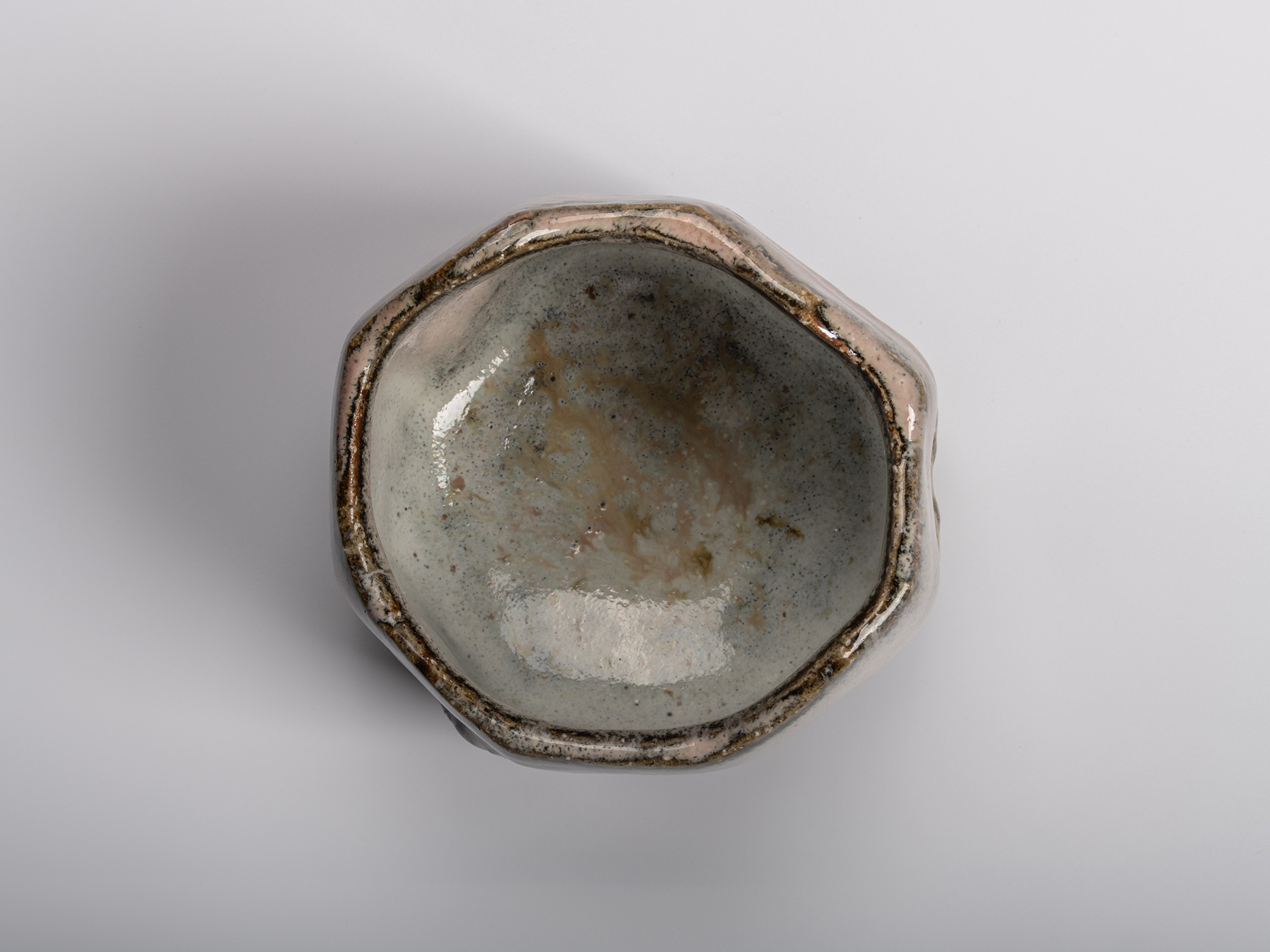Image of interior (mikomi) of Masanao Kaneta’s Haikaburi Kurinuki tea bowl, showing its faceted...