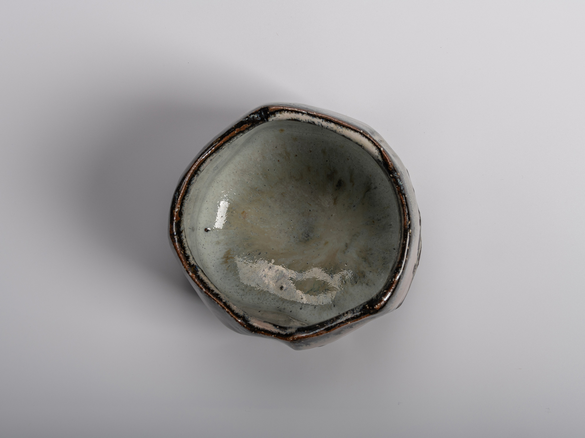Image of interior (mikomi) of Masanao Kaneta’s Haikaburi Kurinuki tea bowl, showing its faceted...