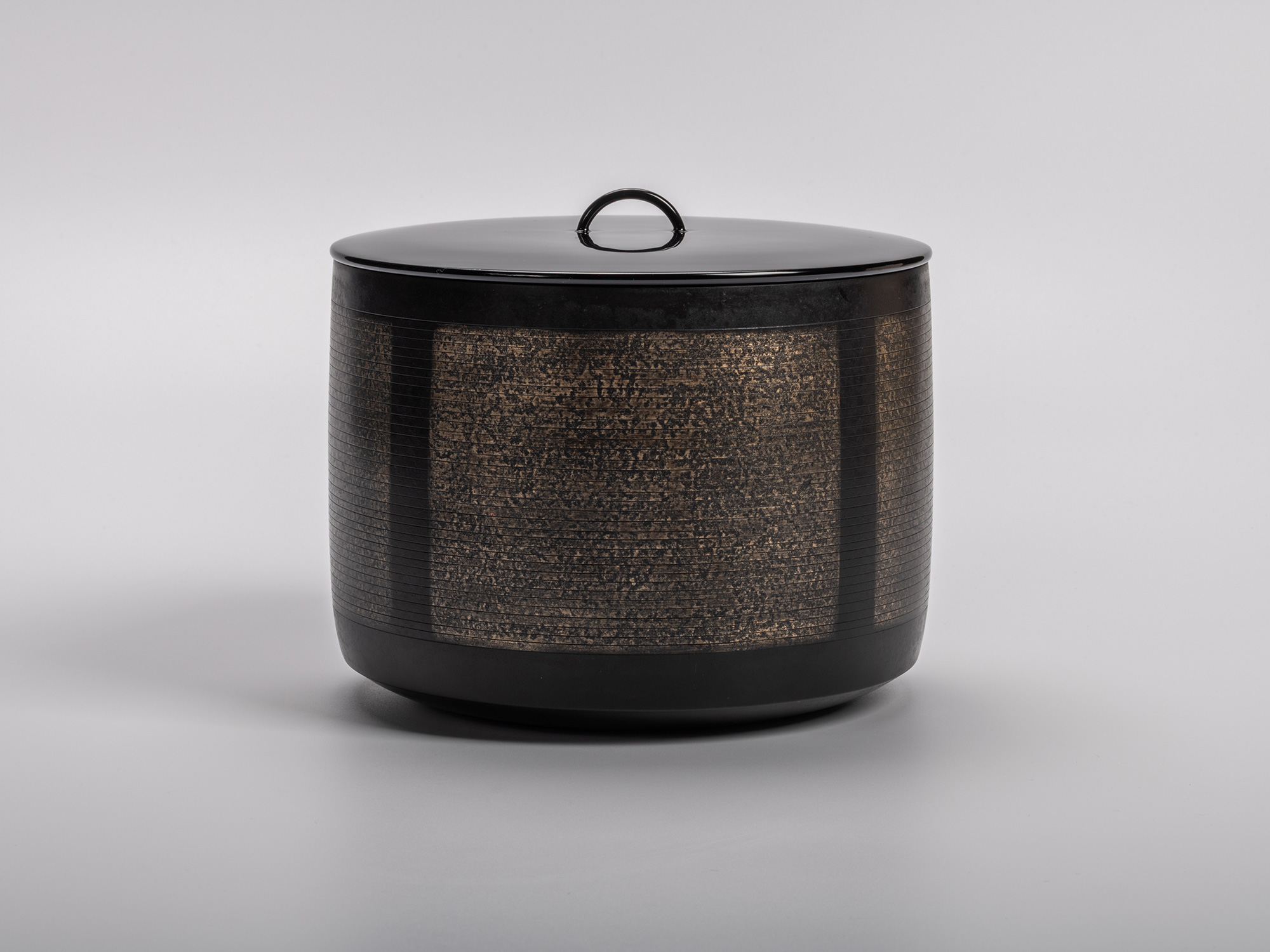 Sahari Water Jug by Uozumi Iraku III, a refined metal vessel with textured bronze panels and a...