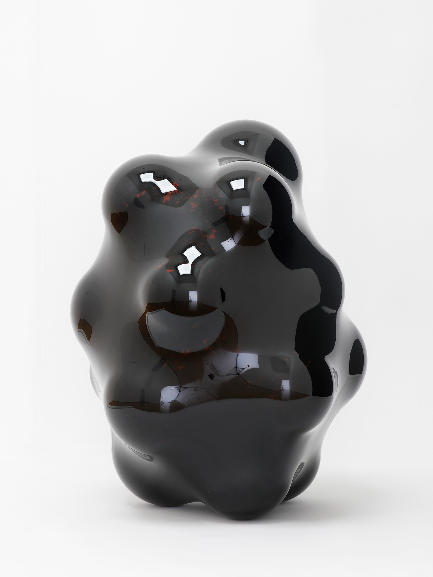 Glossy black urushi lacquer sculpture by Genta Ishizuka with an undulating, biomorphic form, mirror-like...