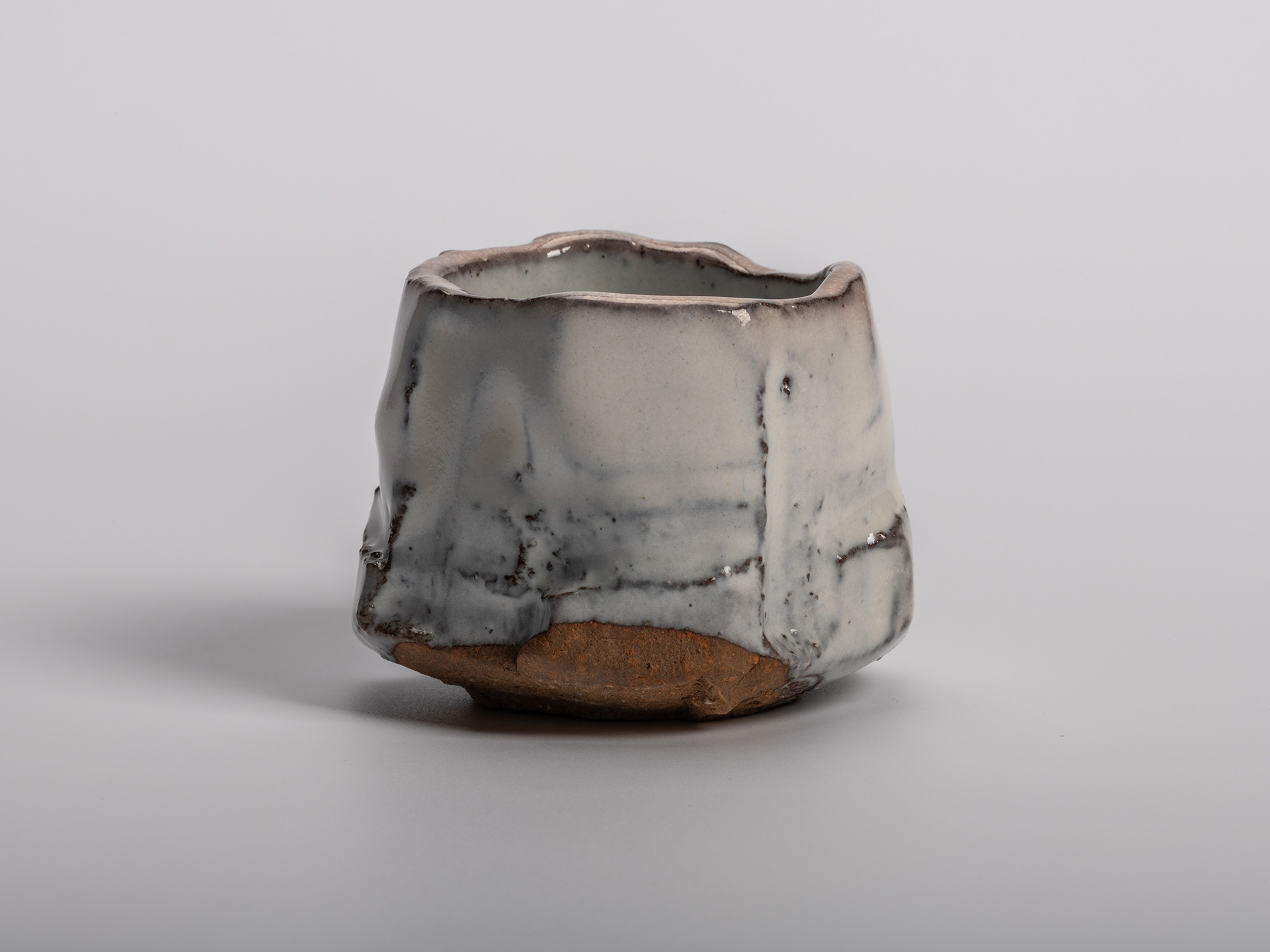 Masanao Kaneta’s White Glaze Youhen Kurinuki Guinomi with hand-carved form, soft white youhen glaze,...