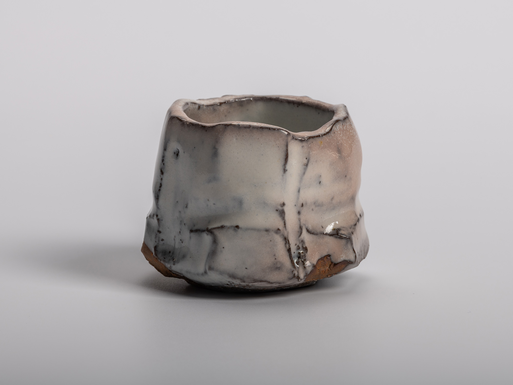 Masanao Kaneta’s White Glaze Youhen Kurinuki Guinomi with hand-carved form, soft white youhen glaze,...