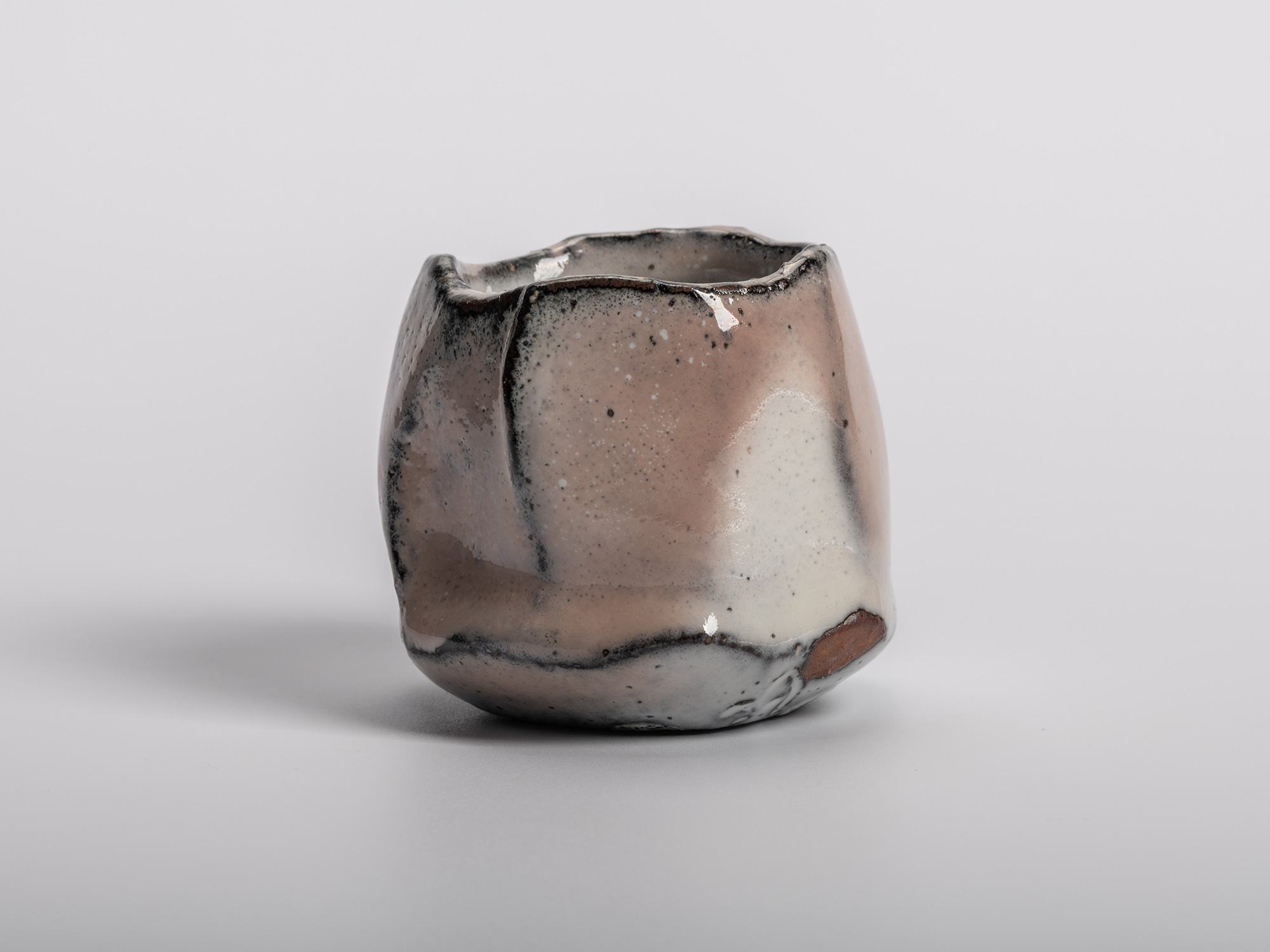 Masanao Kaneta’s White Glaze Youhen Kurinuki Guinomi with hand-carved sculptural form, soft white...