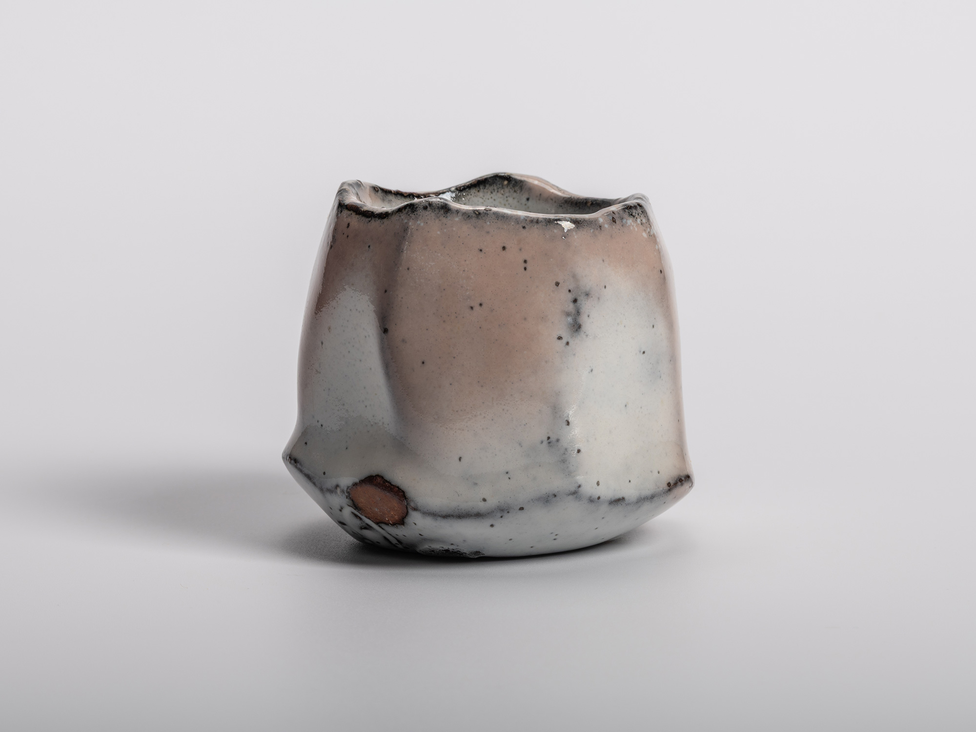 Masanao Kaneta’s White Glaze Youhen Kurinuki Guinomi with hand-carved sculptural form, soft white...