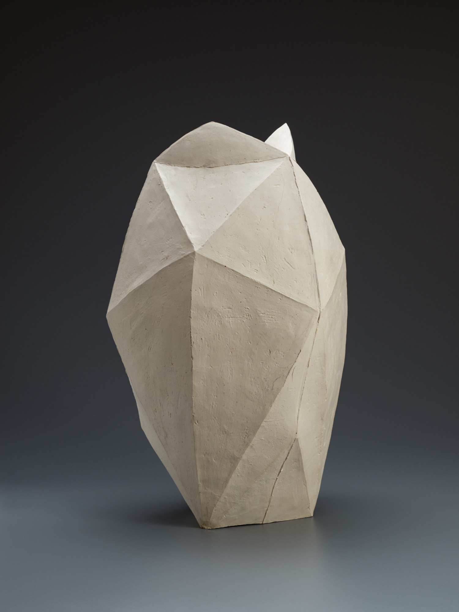 White multifaceted ceramic vase by Mori Tōgaku with sharply folded, paper-like planes and a matte...