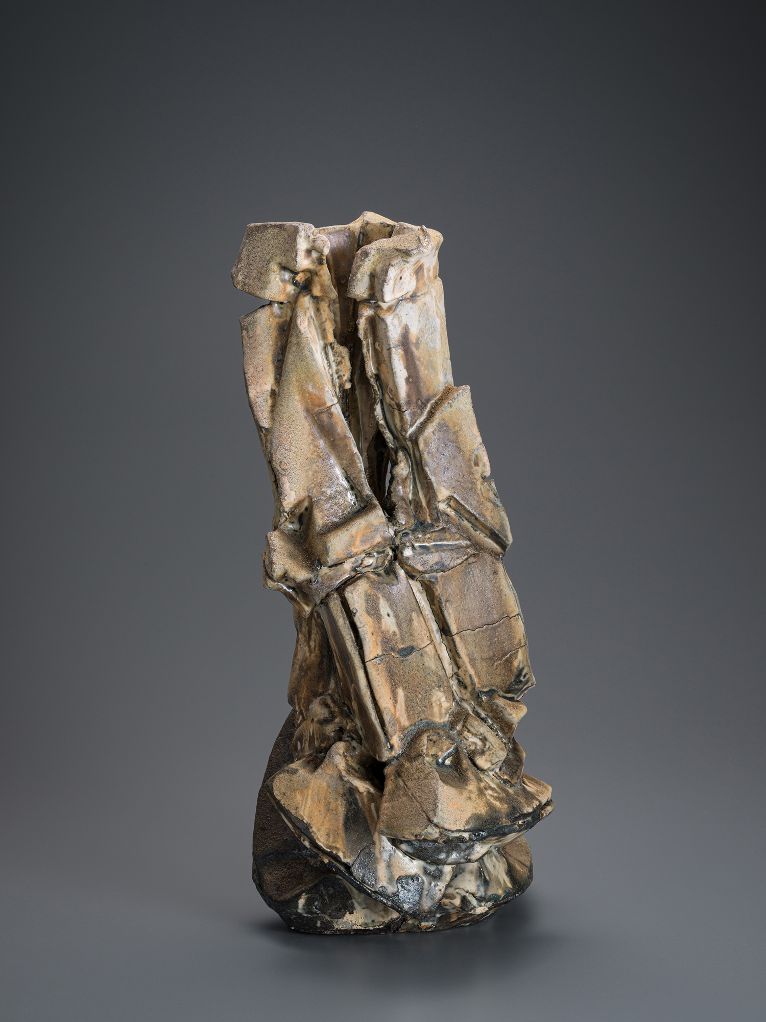 Vertical ceramic sculpture by Shōzō Michikawa featuring angular, folded planes and compressed forms,...