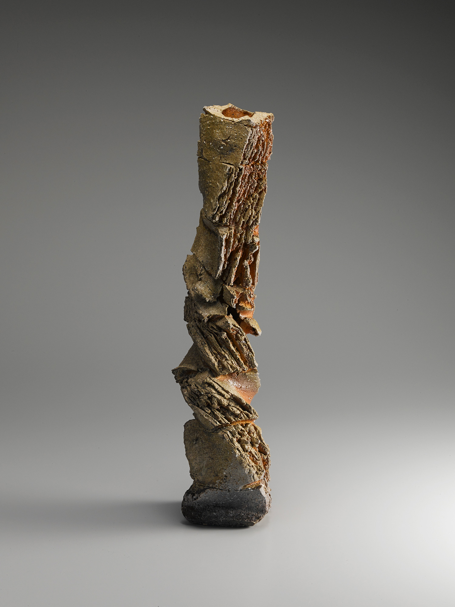 Vertical ceramic sculptural form by Shōzō Michikawa composed of stacked, twisted segments with...
