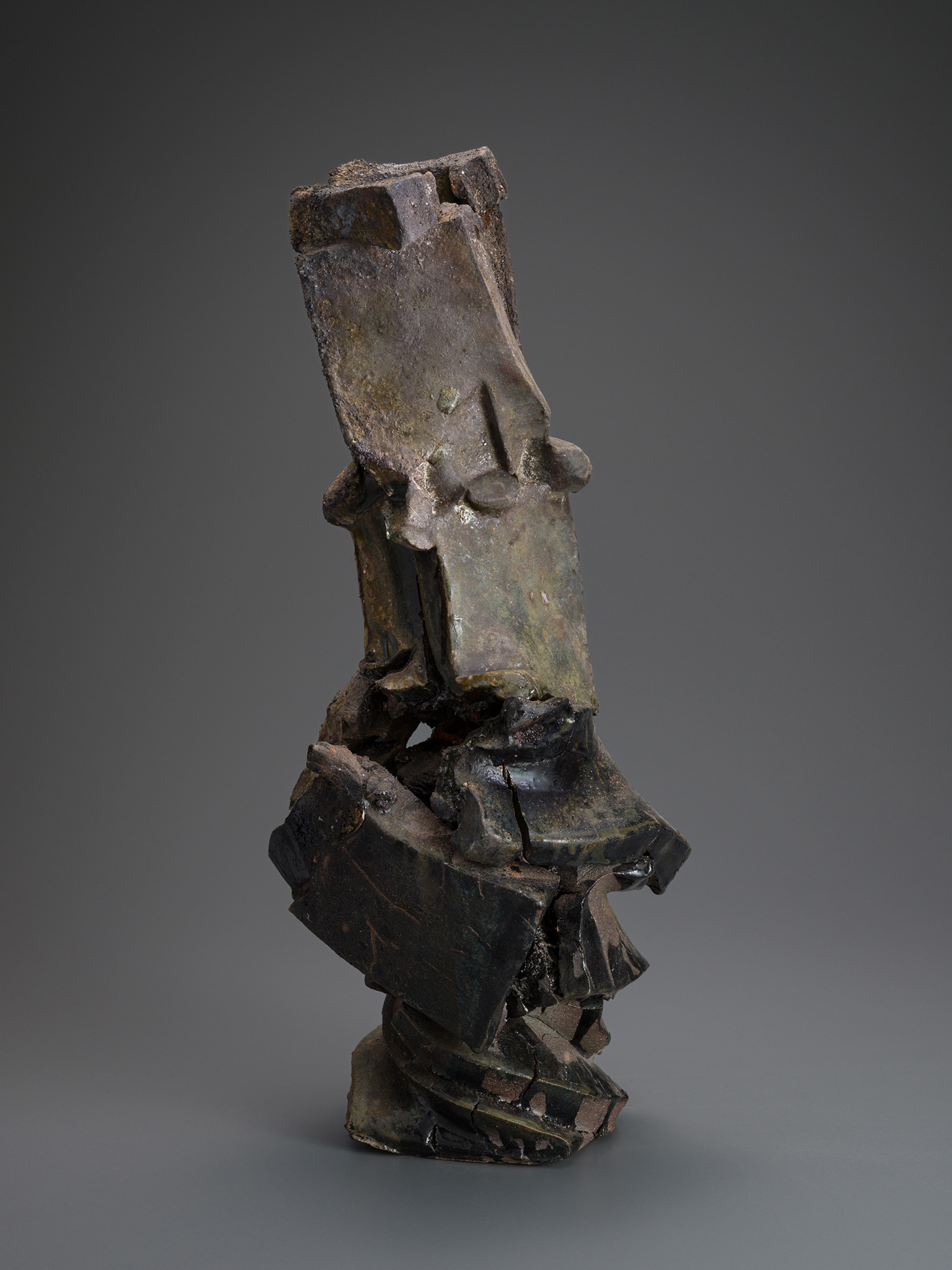 Vertical ceramic sculpture titled Volcano by Shōzō Michikawa, composed of stacked, fractured planes...