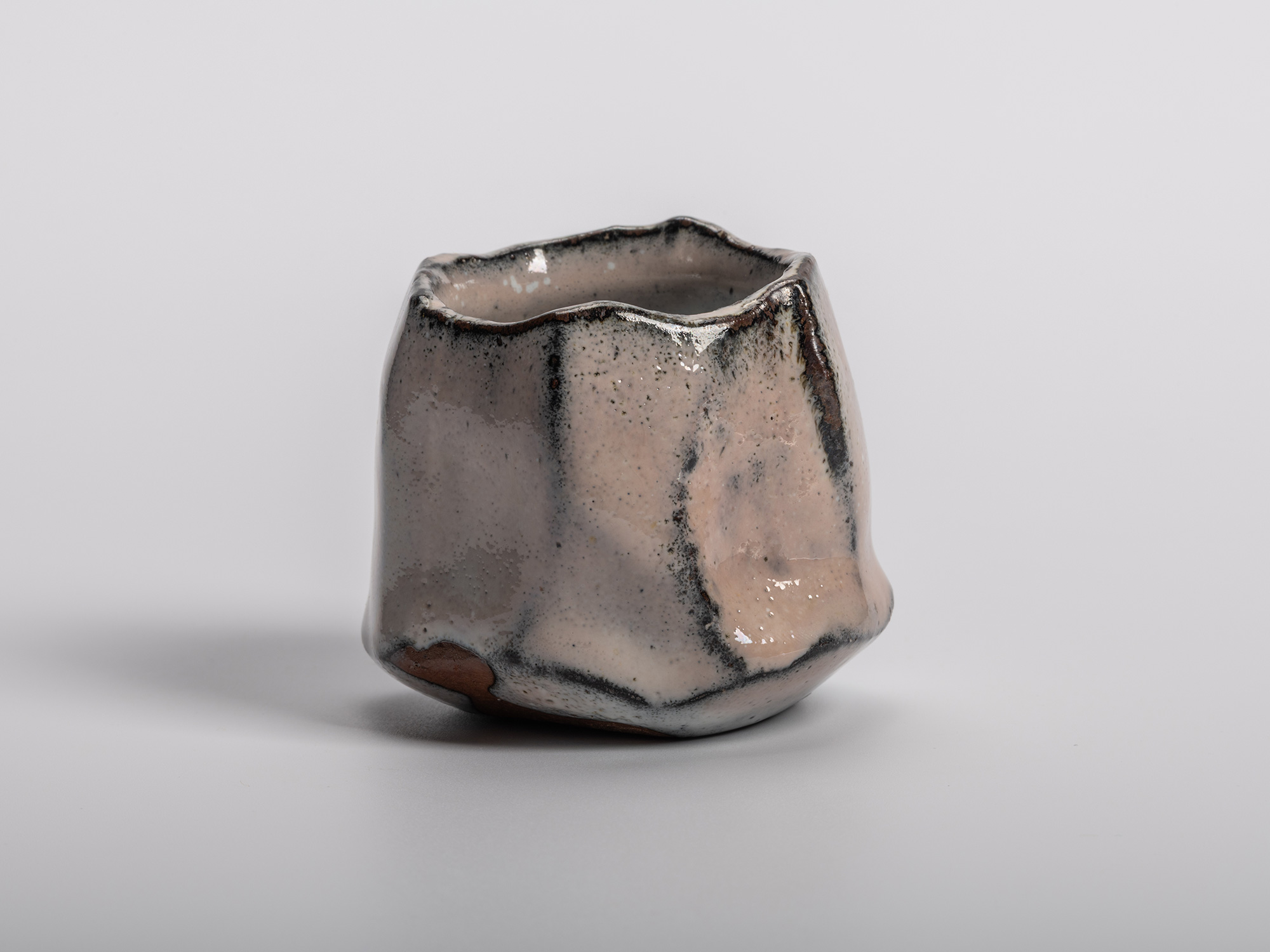 Masanao Kaneta’s White Glaze Youhen Kurinuki Guinomi with hand-carved sculptural form, soft white...