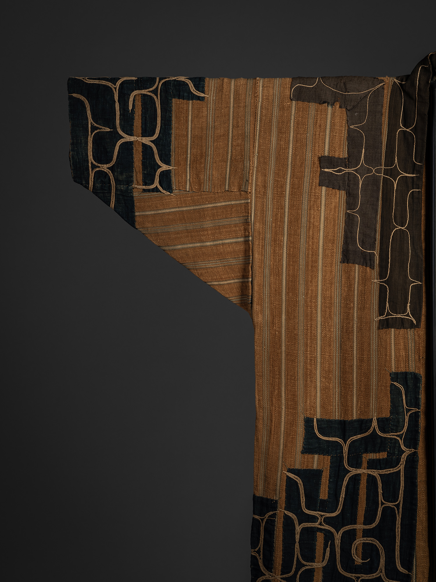 Detail of the front right sleeve of a mid-19th-century Ainu attush robe, showing layered elm bark...