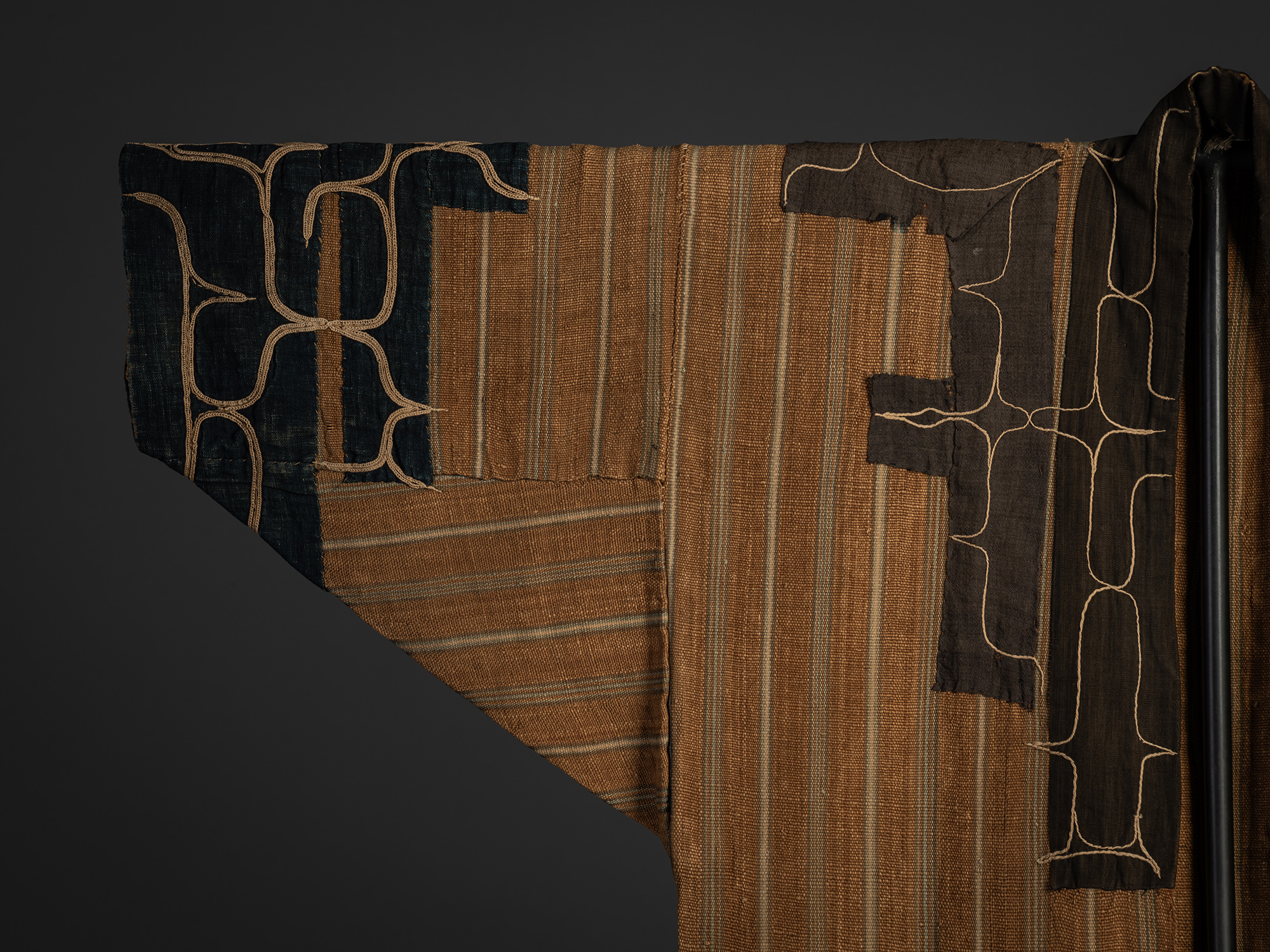 Detail of the front right sleeve of a mid-19th-century Ainu attush robe, showing layered elm bark...