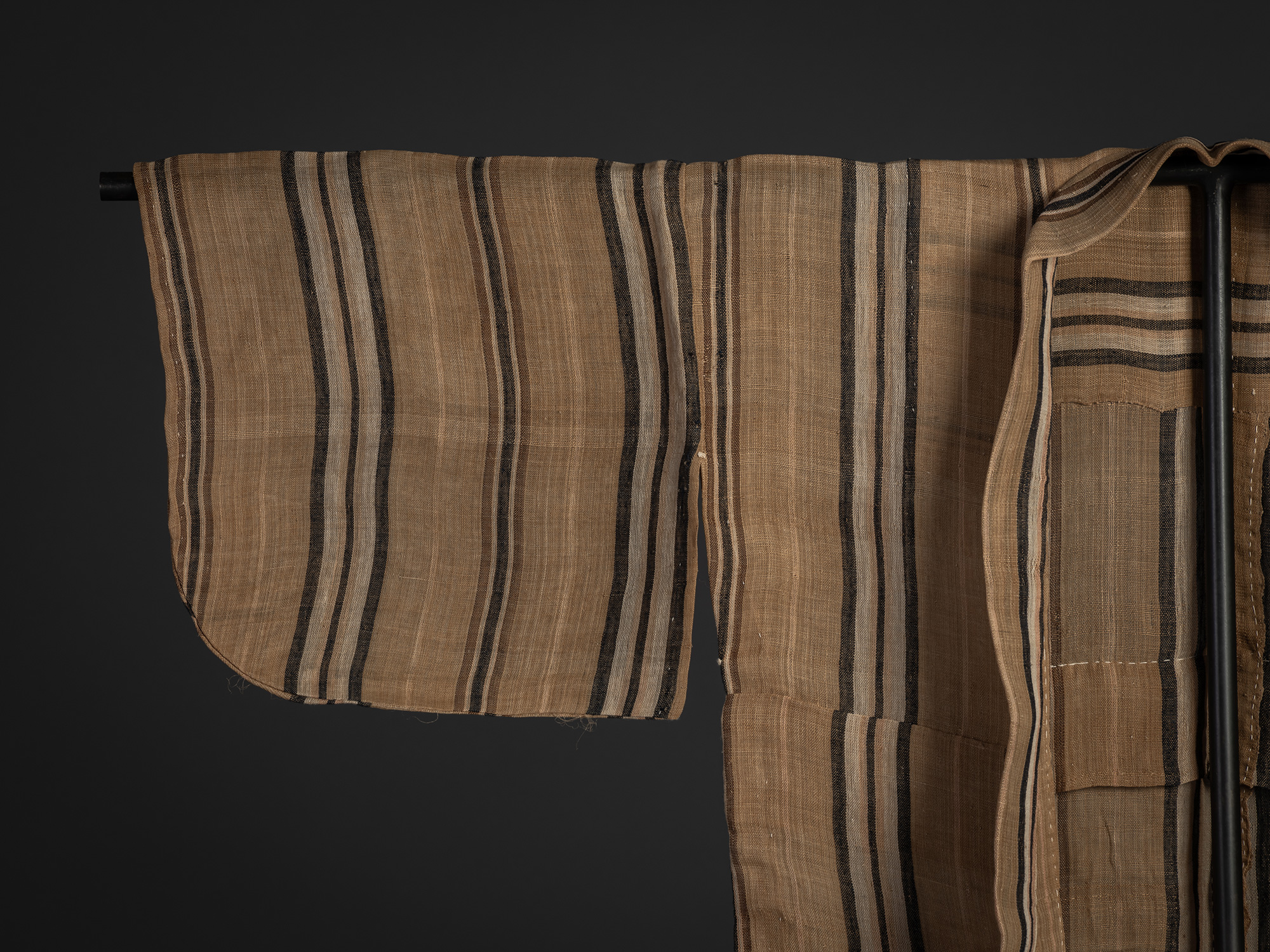 Detail of front right sleeve of a late 19th–early 20th century bashōfu kimono, showing finely woven...