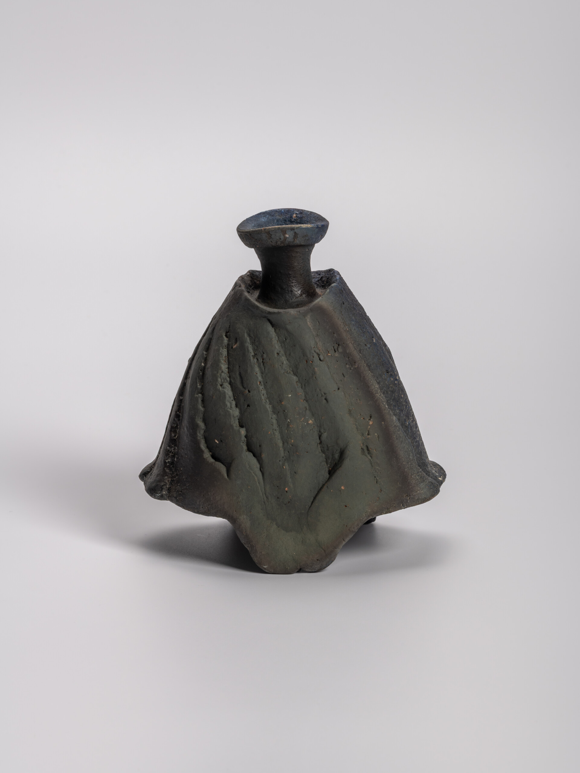 lack tokkuri (sake flask) by Ryuichi Kakurezaki, shown frontally against a neutral background....