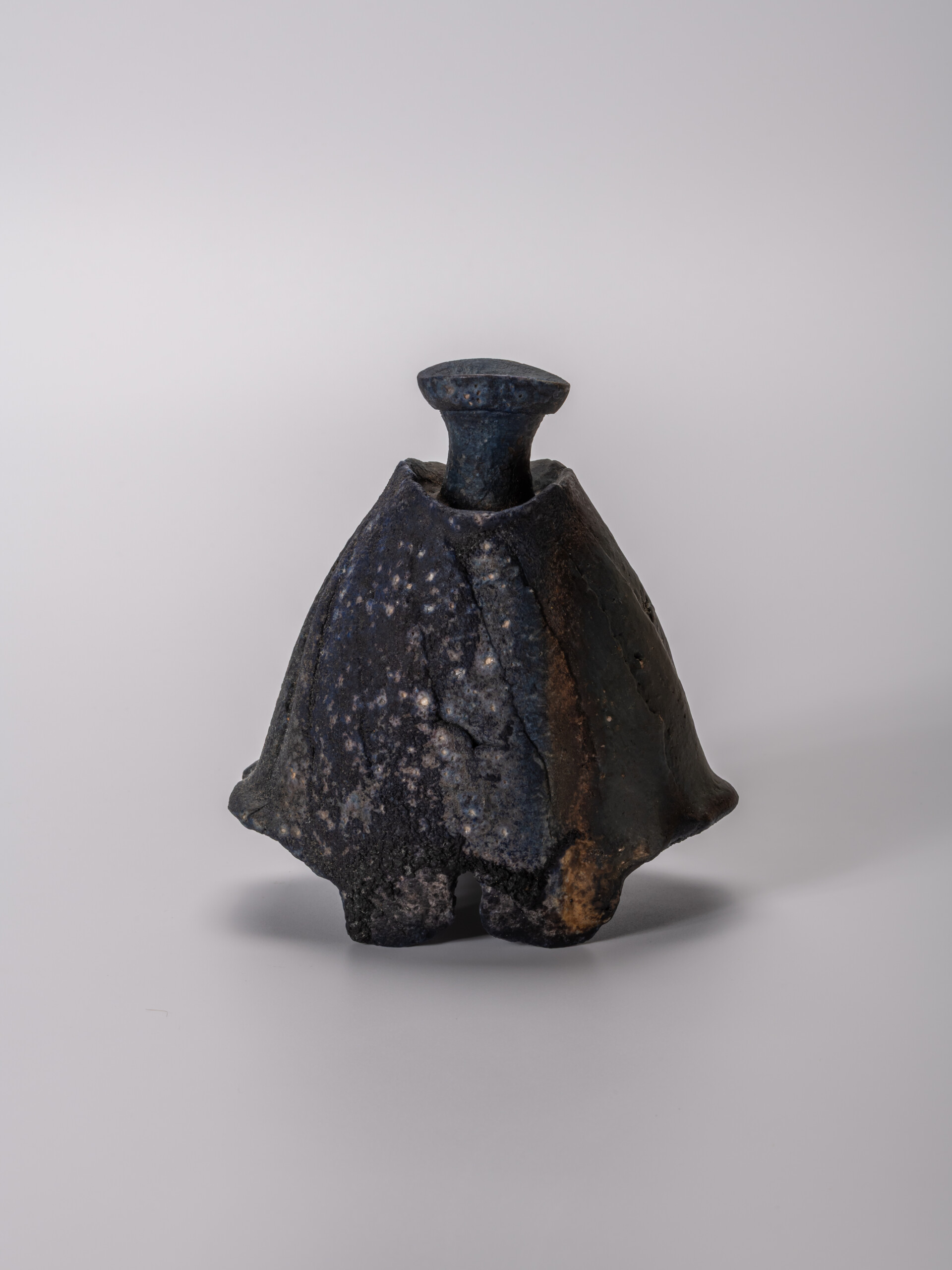 lack tokkuri (sake flask) by Ryuichi Kakurezaki, shown frontally against a neutral background....
