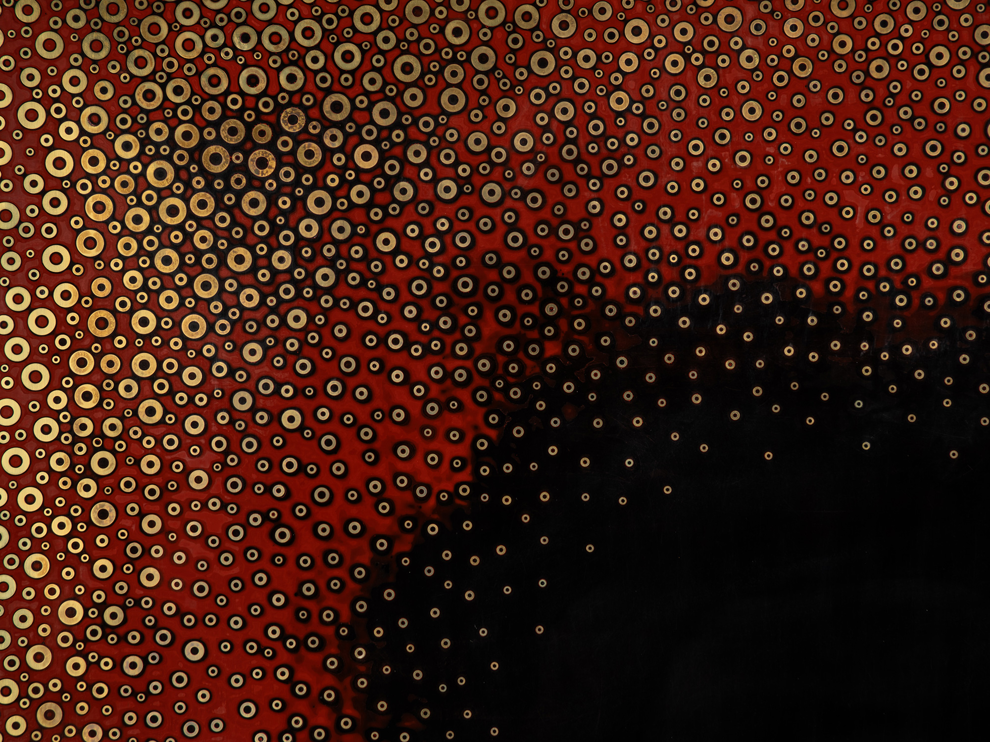 Detail of Dark Light by Genta Ishizuka showing dense fields of gold- and black-toned metal washers...