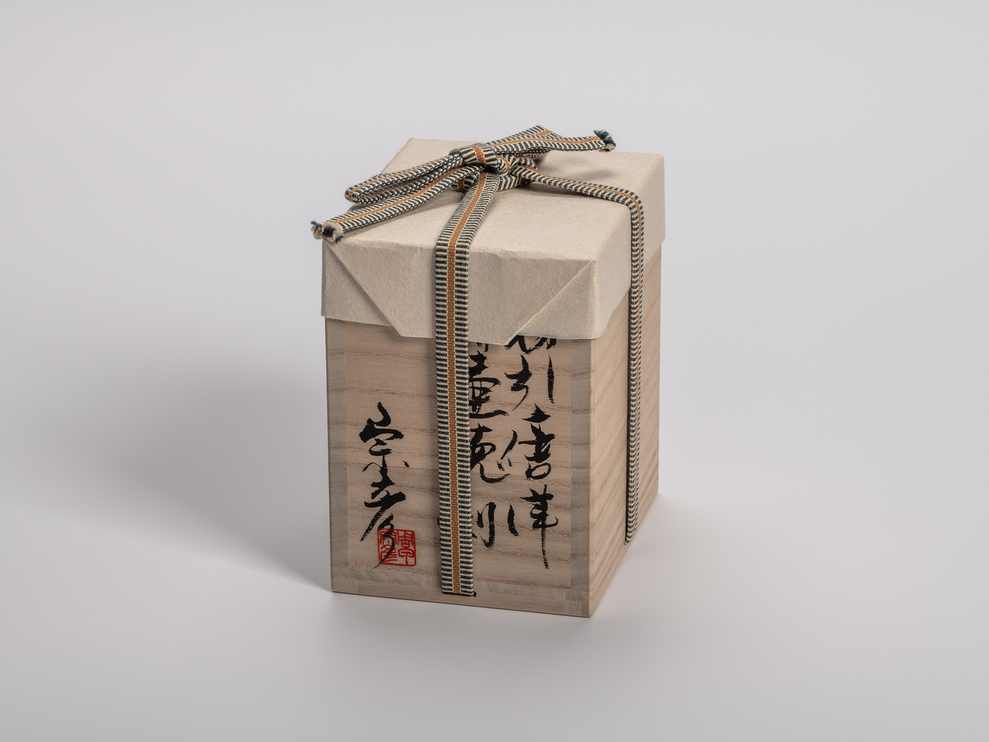 Square wooden tomobako (artist-signed storage box) with calligraphy and artist seal. The box is...