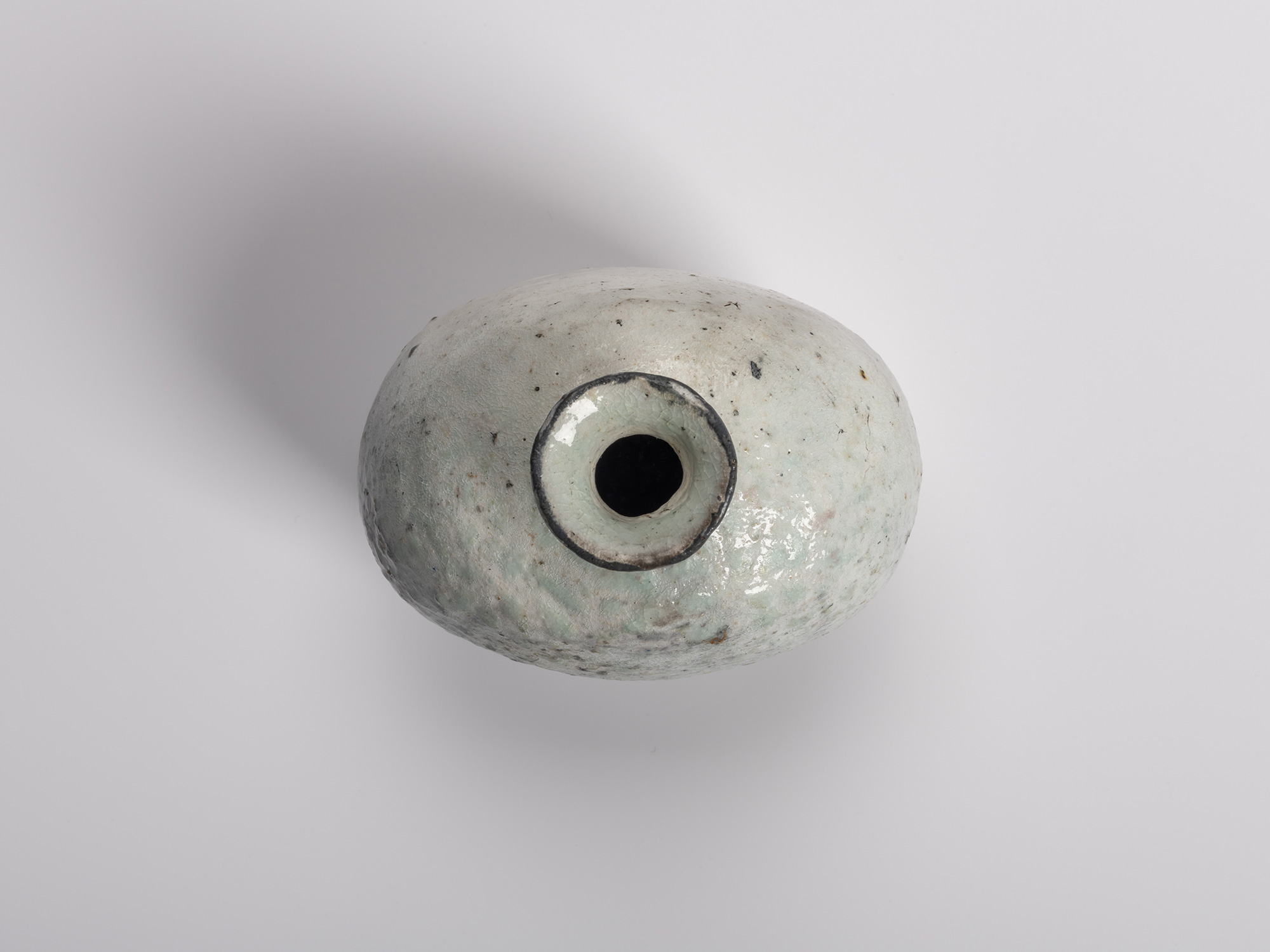 Aerial view of a haikaburi tokkuri (sake bottle), showing the rounded, ash-glazed shoulder and...