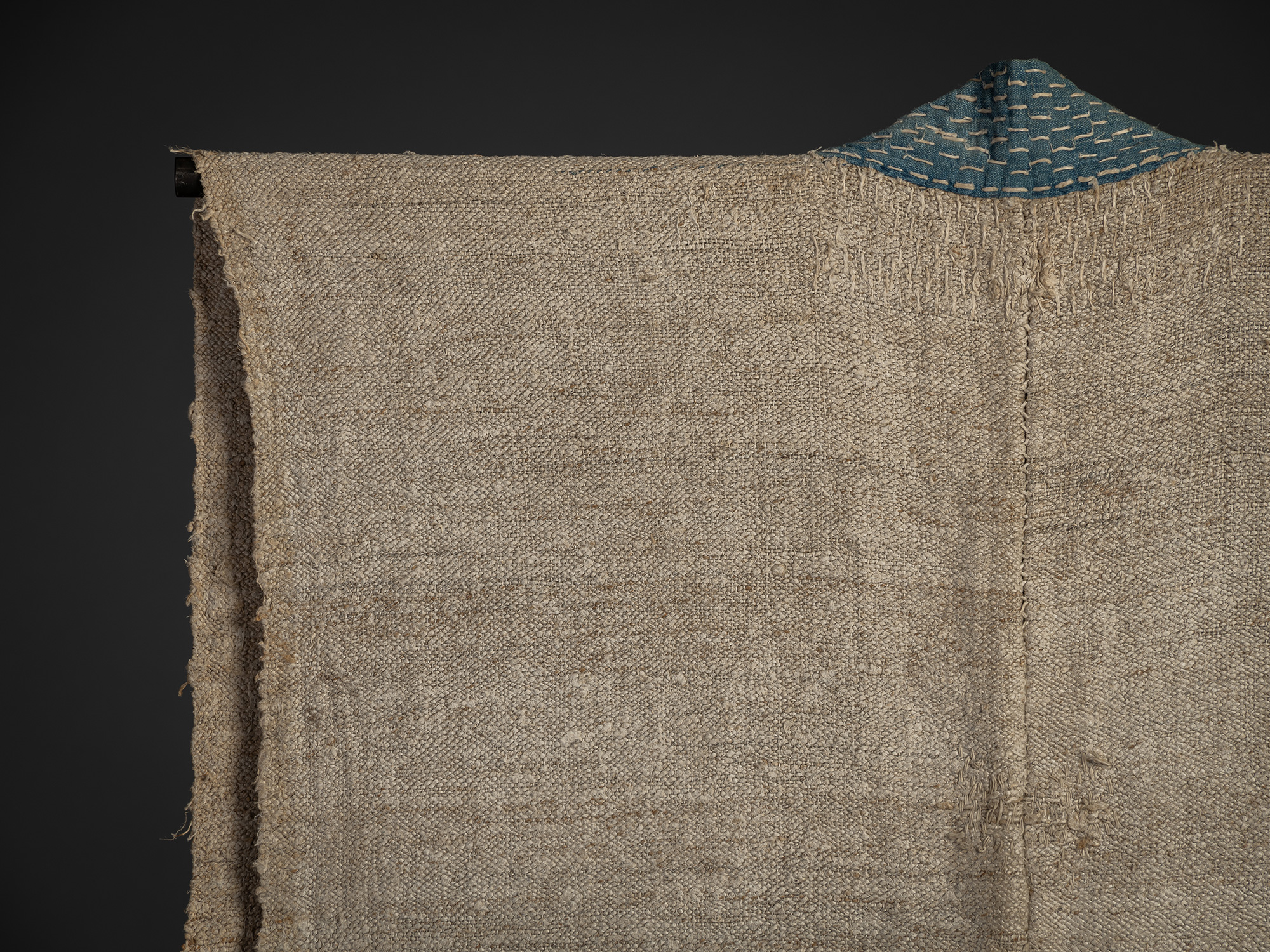 Detail of back left shoulder of late 19th-century okusozakkuri garment made of hemp and cotton,...