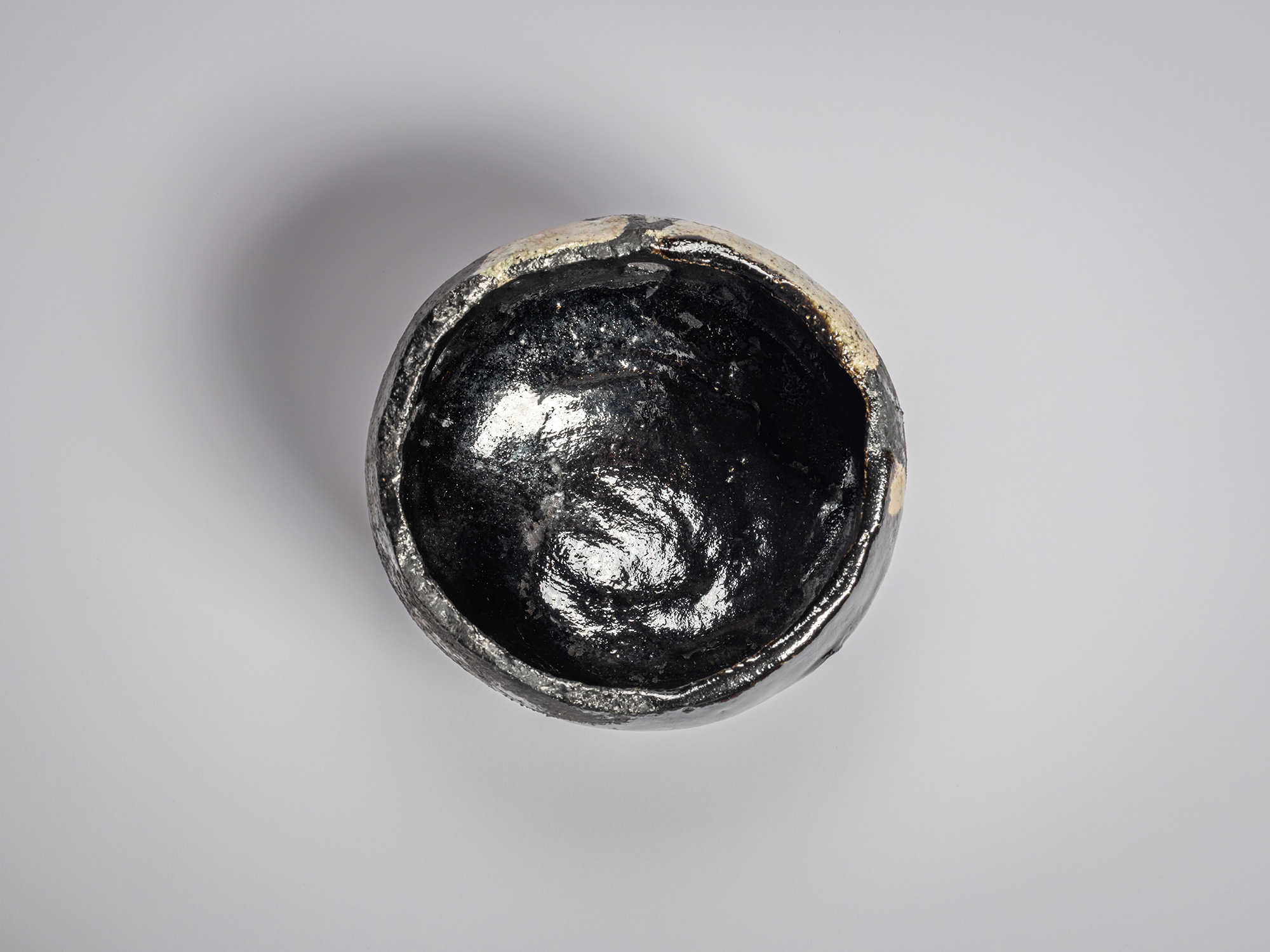 interior (mikomi) of tea bowl entitled Rōbokubai (Old Plum Tree)” by Raku Kichizaemon XV
