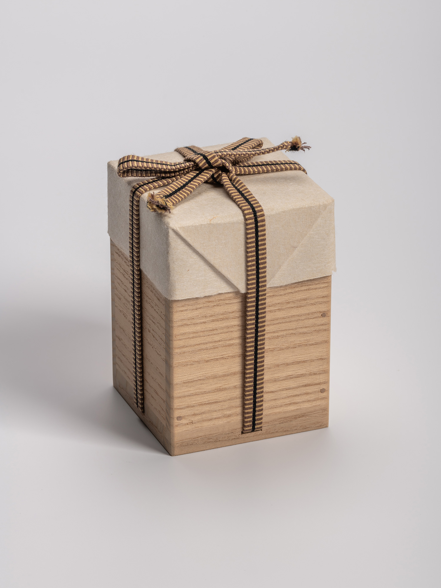 Rectangular wooden tomobako (artist-signed storage box) by ceramic artist, shown with its striped...