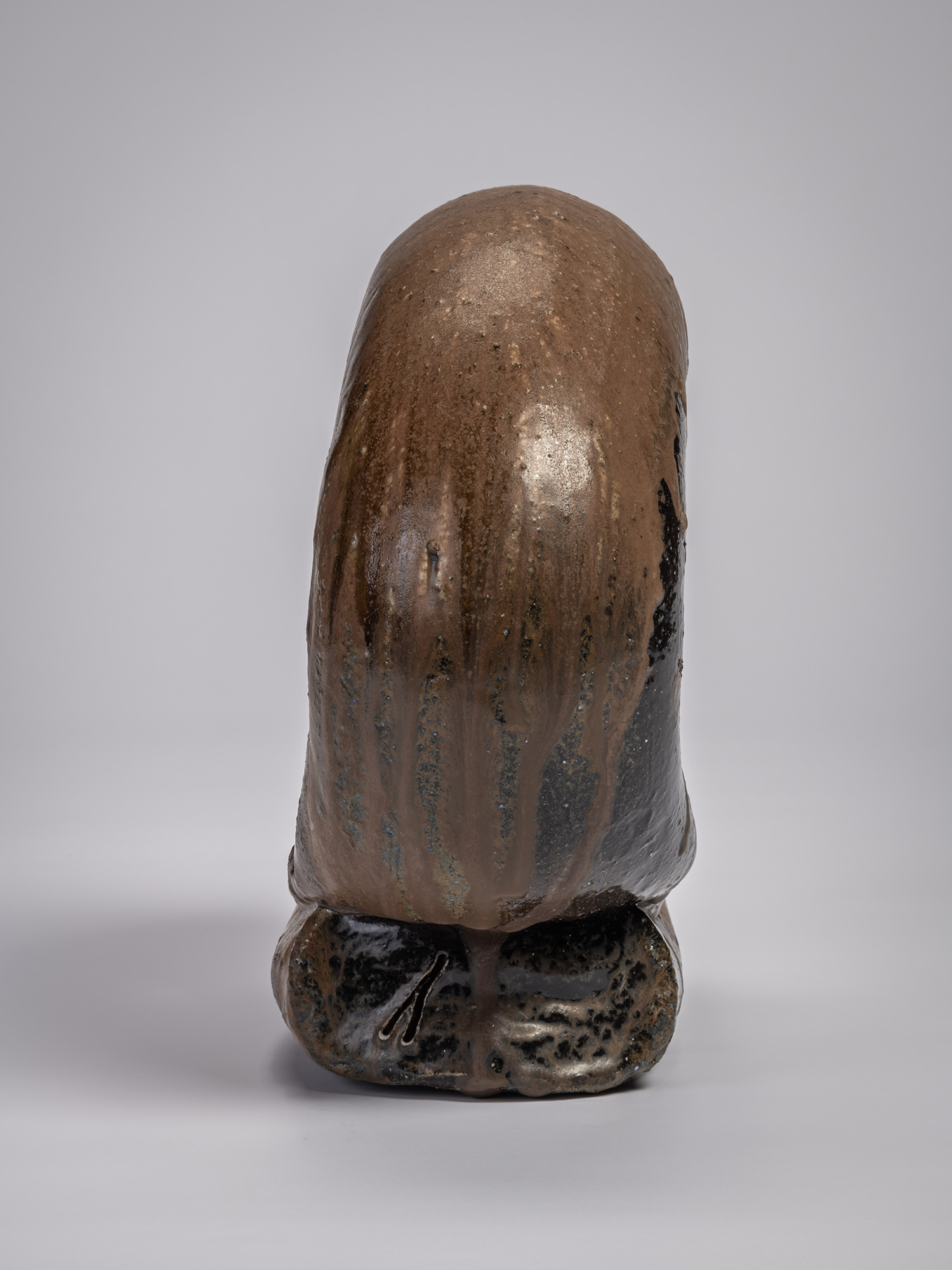 Profile view of the ceramic sculpture Ring by Jun Isezaki, depicting a vertically oriented sculptural...