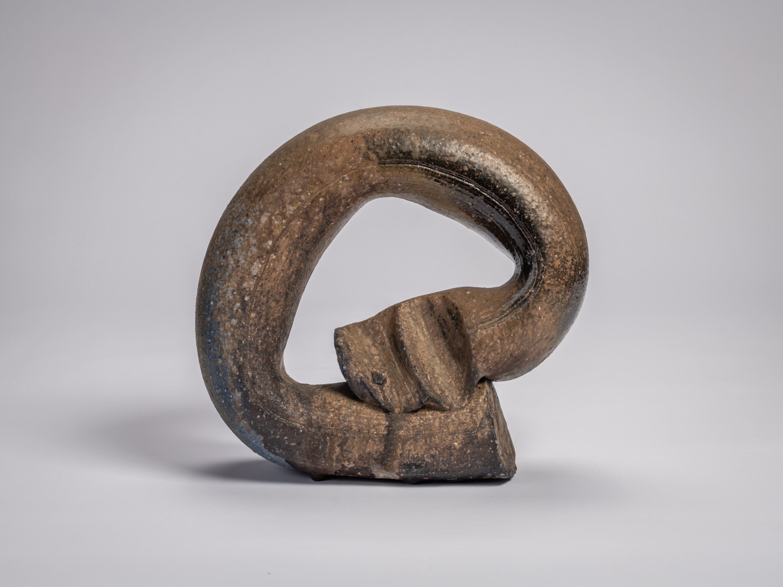 Ceramic sculpture titled Ring by Jun Isezaki, featuring a thick circular form with an open center...