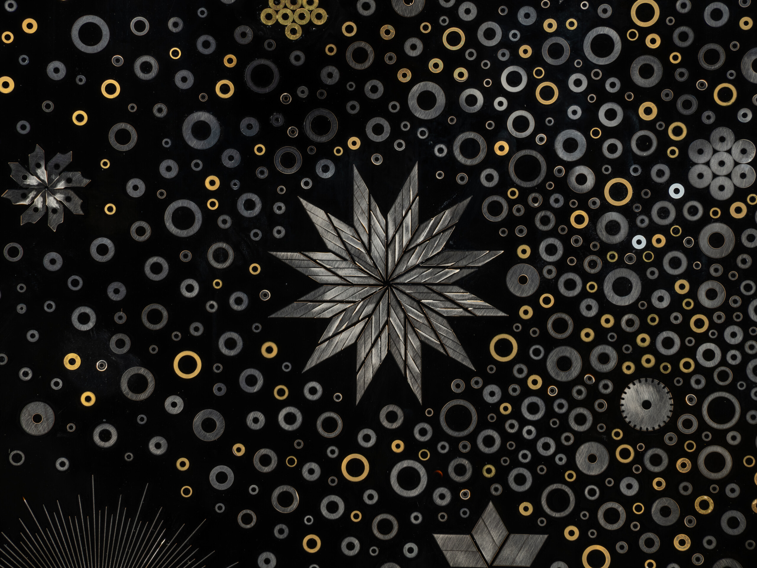 etail of Stellar Dance by Genta Ishizuka featuring a radiant starburst formed from layered cutter...