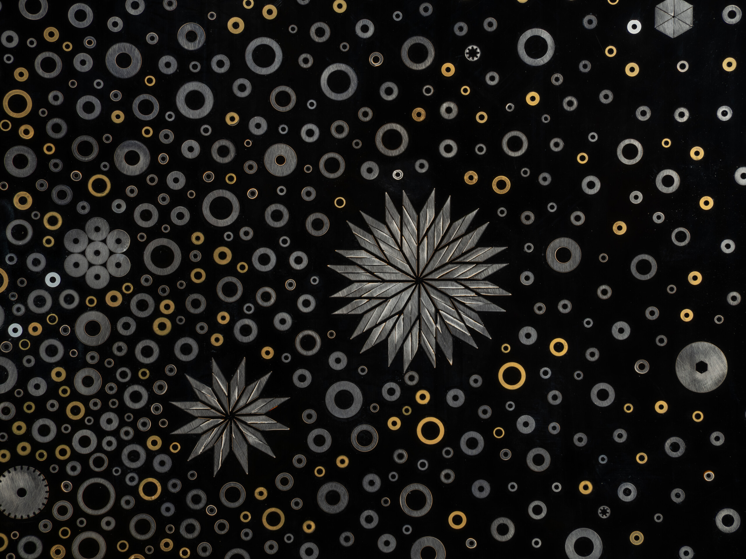 Detail of Stellar Dance by Genta Ishizuka showing multiple starburst forms constructed from layered...