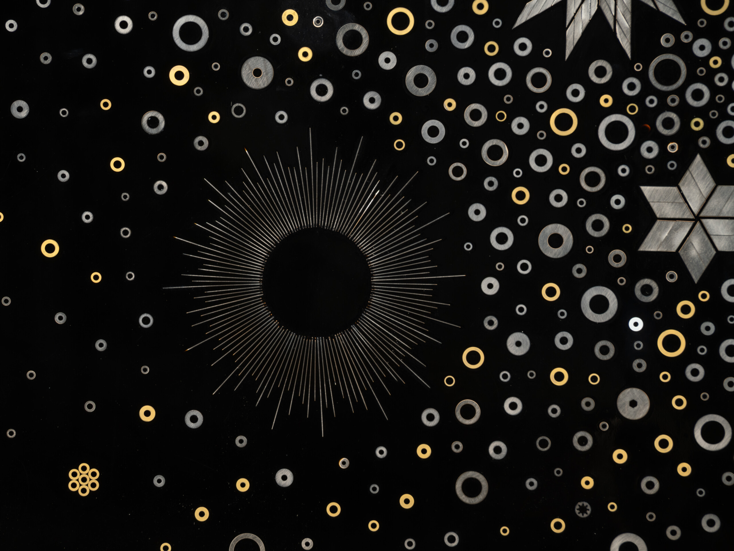 Detail of Stellar Dance by Genta Ishizuka showing a radiant circular halo formed from fine metal...