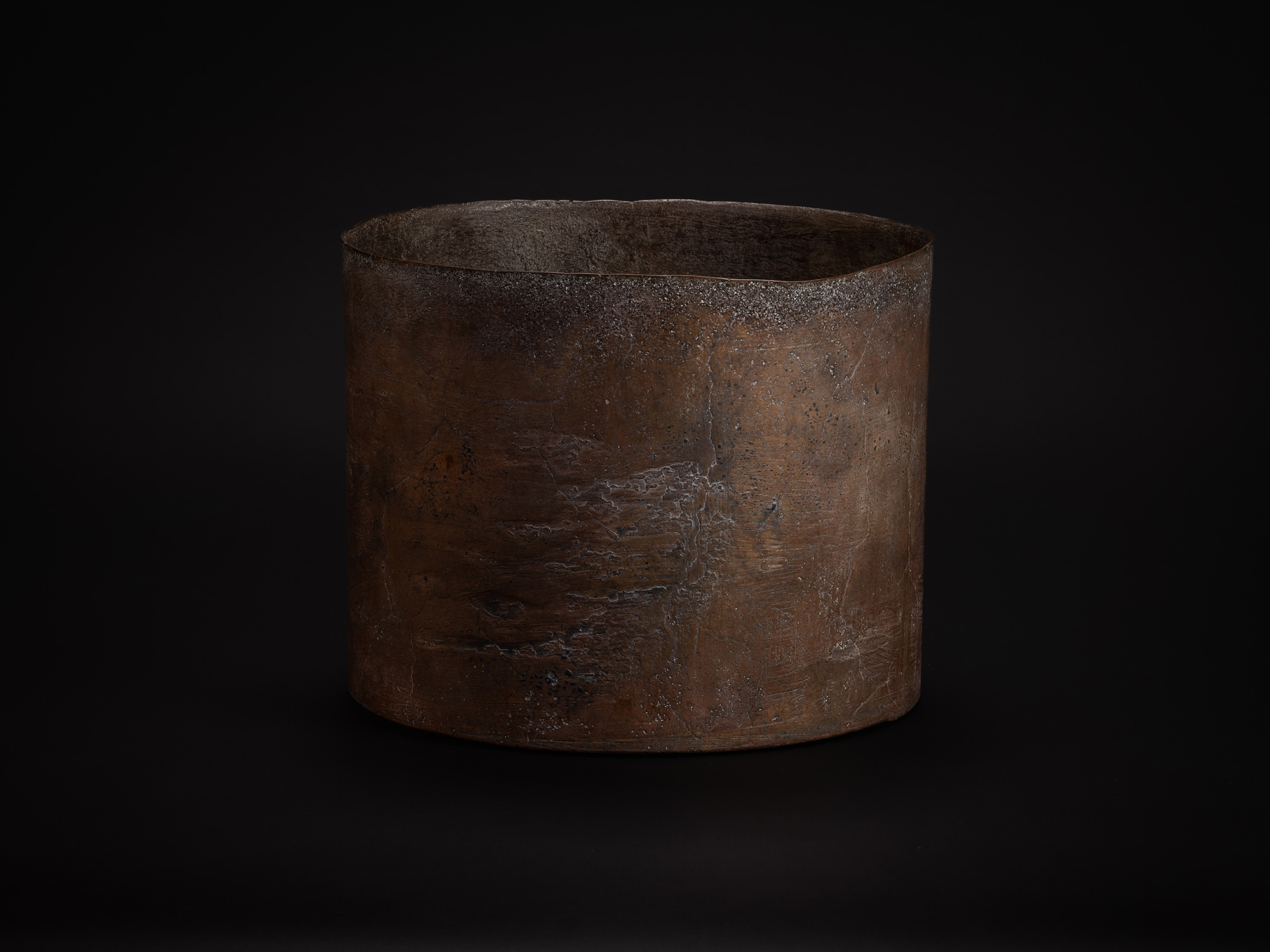 Bronze Cylinder by Koji Hatakeyama, vessel featuring a thick-walled, open form with a subtly irregular...