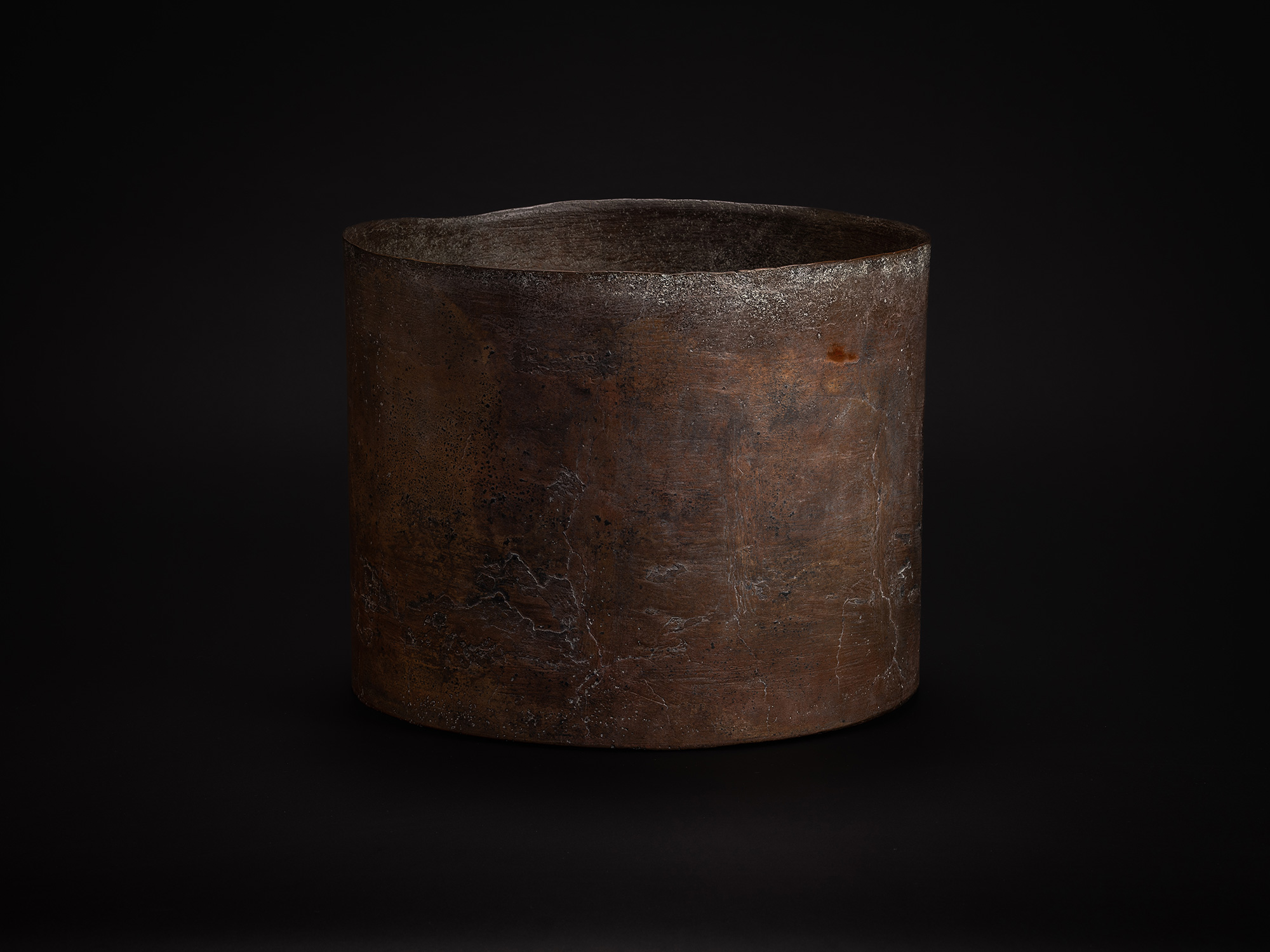 Bronze Cylinder by Koji Hatakeyama, vessel featuring a thick-walled, open form with a subtly irregular...