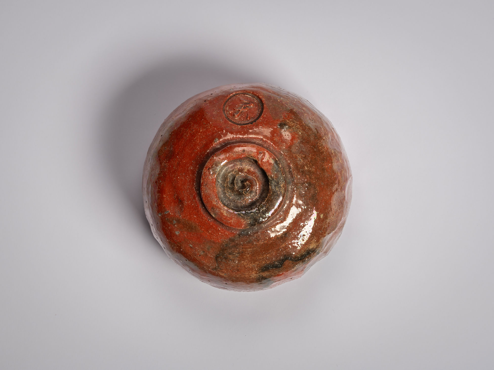 Foot (kōdai) of the Red Raku tea bowl Daiyūhō (Great Peak) by Raku IX, showing a rounded, wheel-finished...