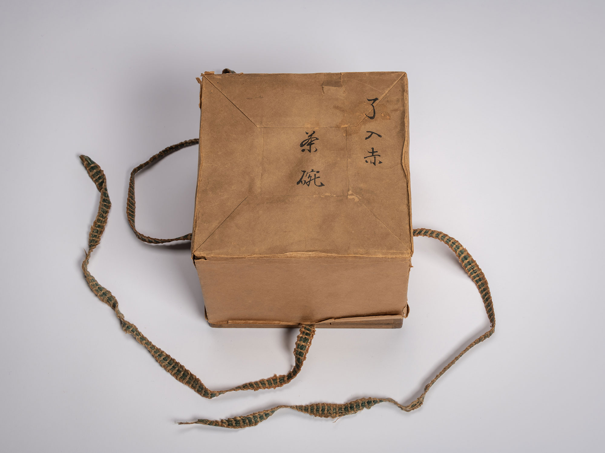 Protective outer box for a Japanese tea ceremony bowl, featuring hand-painted kanji characters...