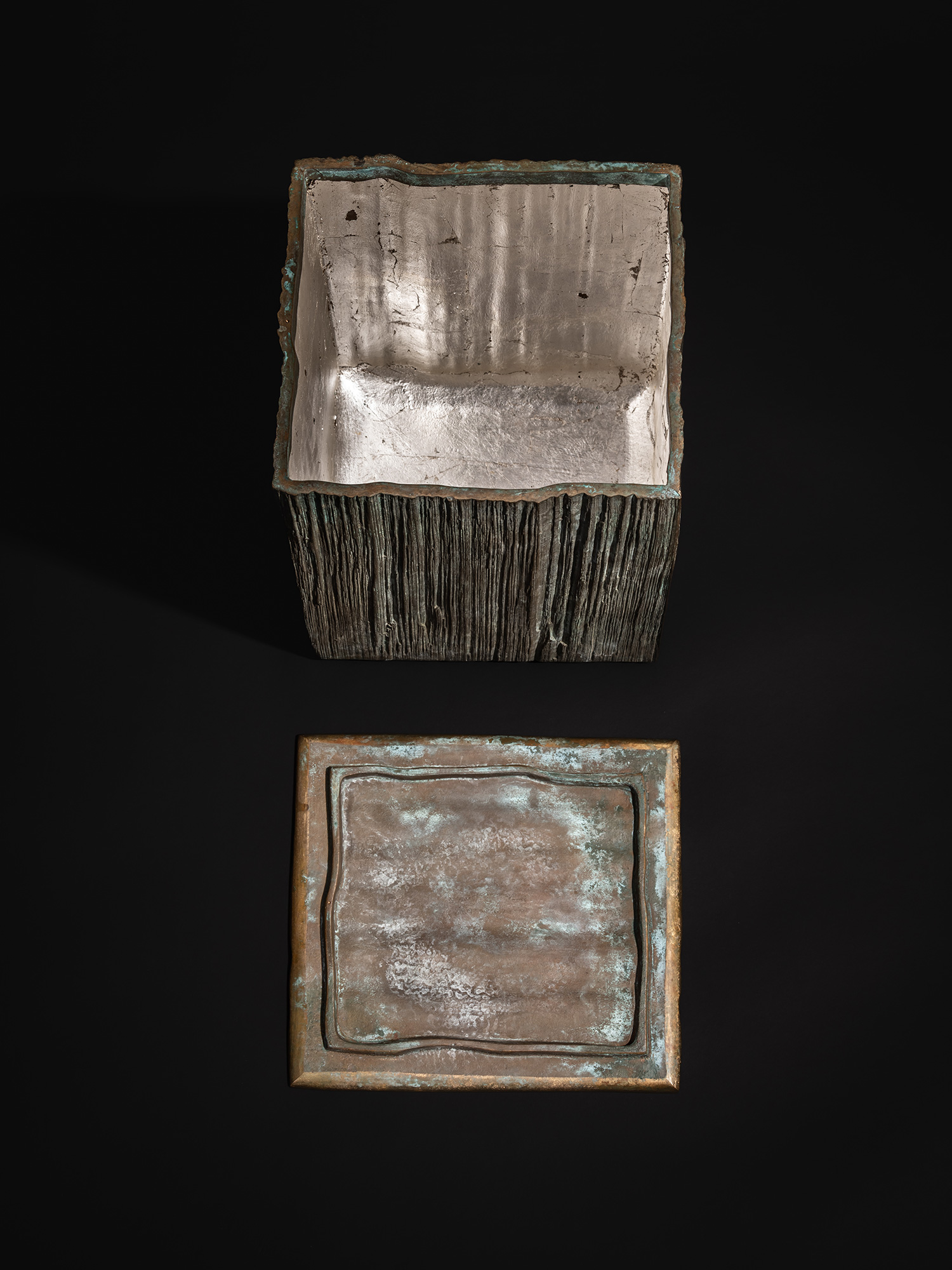Single photograph showing the bronze box and detached lid from Green Expression by Koji Hatakeyama...