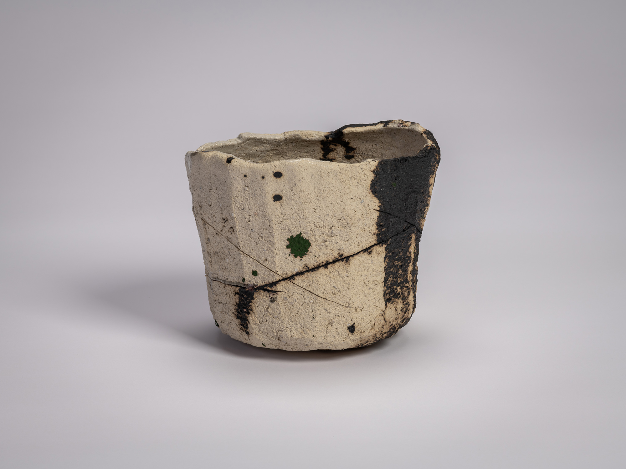 Tea bowl Gyō by Raku XV (Jikinyū), formed from white rock clay with a cylindrical, hand-built shape,...