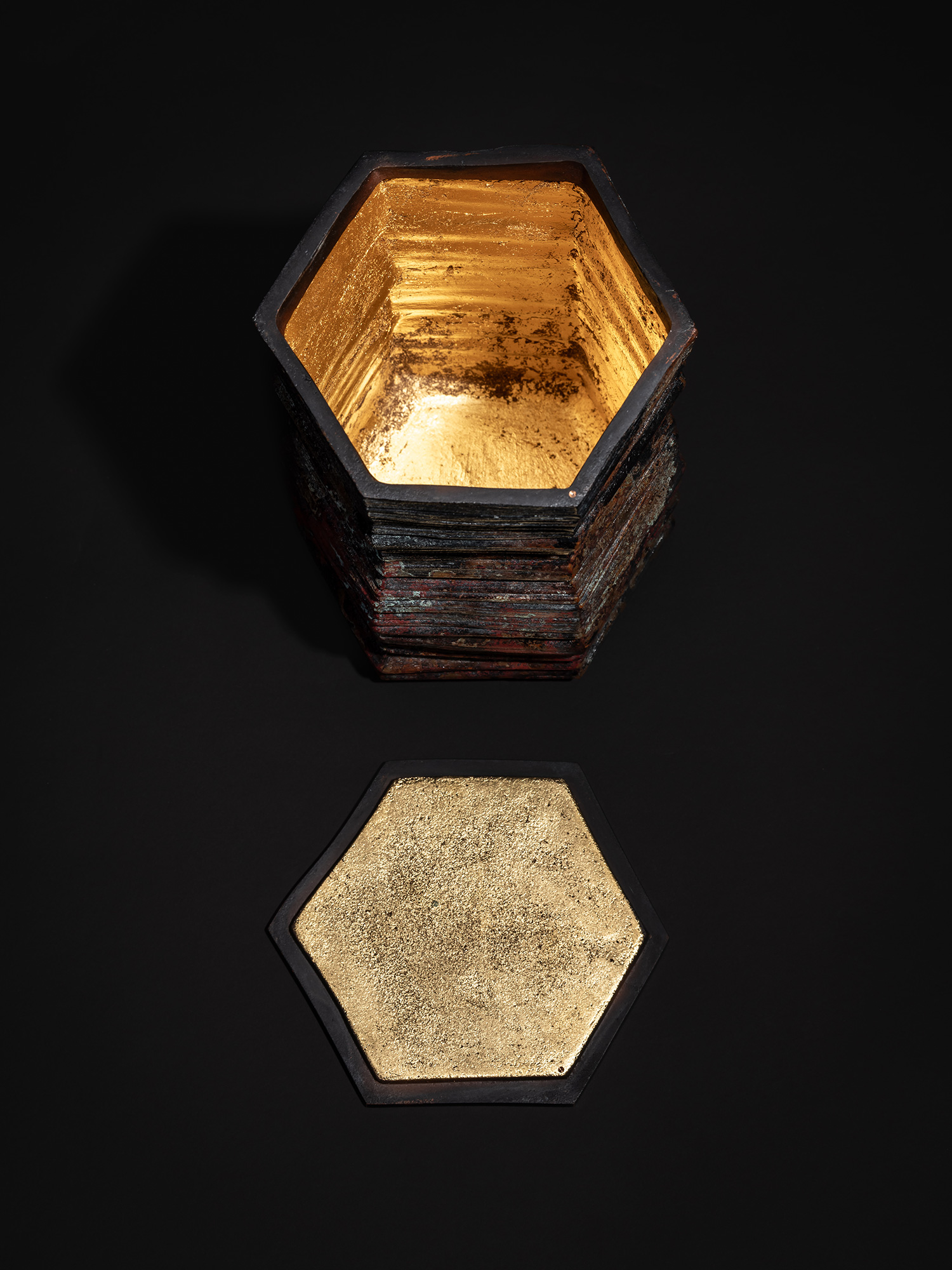 Single photograph showing the bronze sculpture Hexagonal Strips by Koji Hatakeyama with the lid...