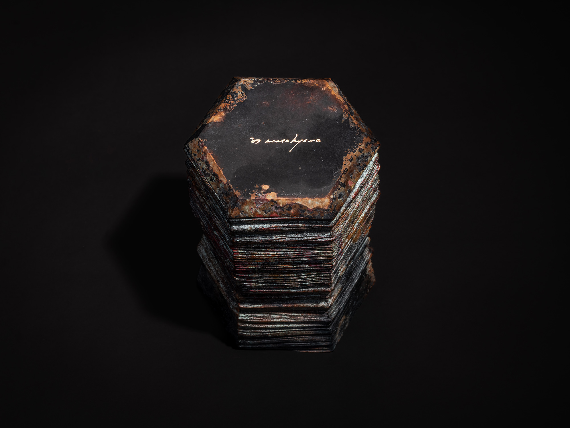 Bottom view of the bronze sculpture Hexagonal Strips by Koji Hatakeyama, showing a hexagonal base...