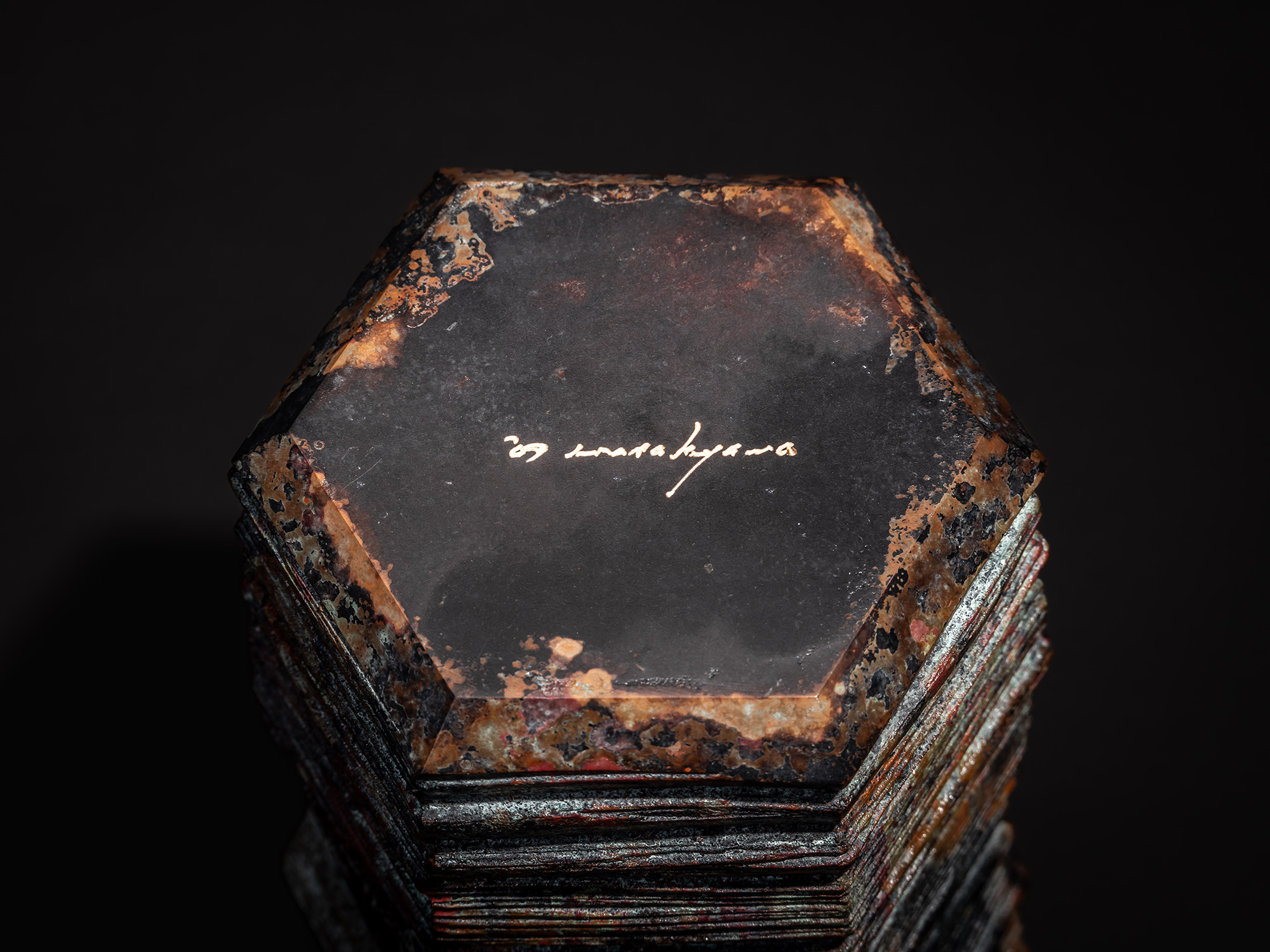 Close up view of bottom view of the bronze sculpture Hexagonal Strips by Koji Hatakeyama, showing...