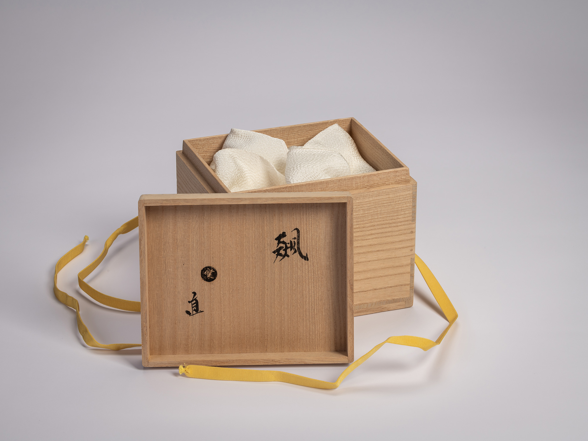 Interior of the wooden artist box for the tea bowl Hyō by Raku XV (Jikinyū), showing silk padding...