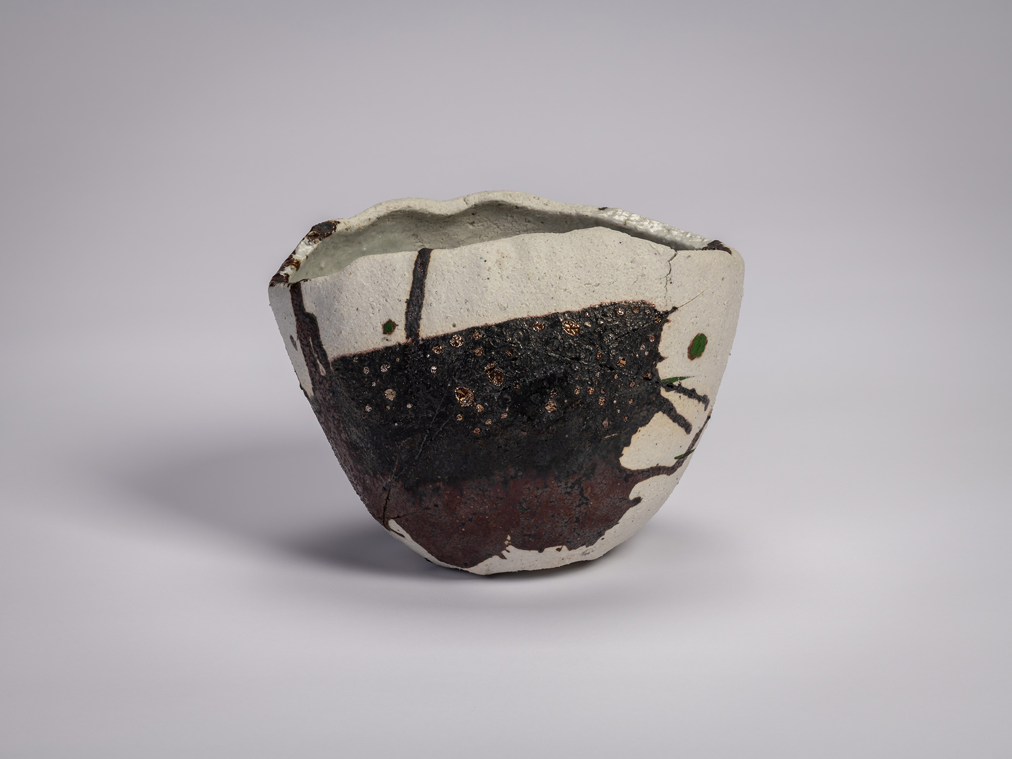 Tea bowl Hyō by Raku XV (Jikinyū), featuring an irregular hand-formed shape with a pale clay body,...