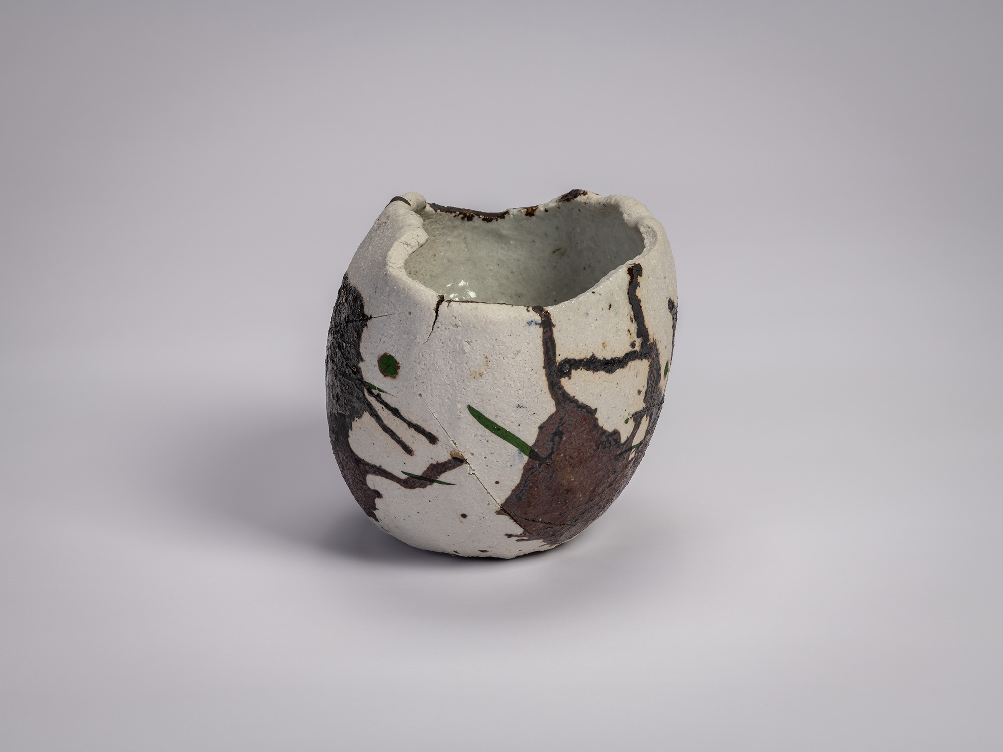 Side view of Tea bowl Hyō by Raku XV (Jikinyū), featuring an irregular hand-formed shape with a...