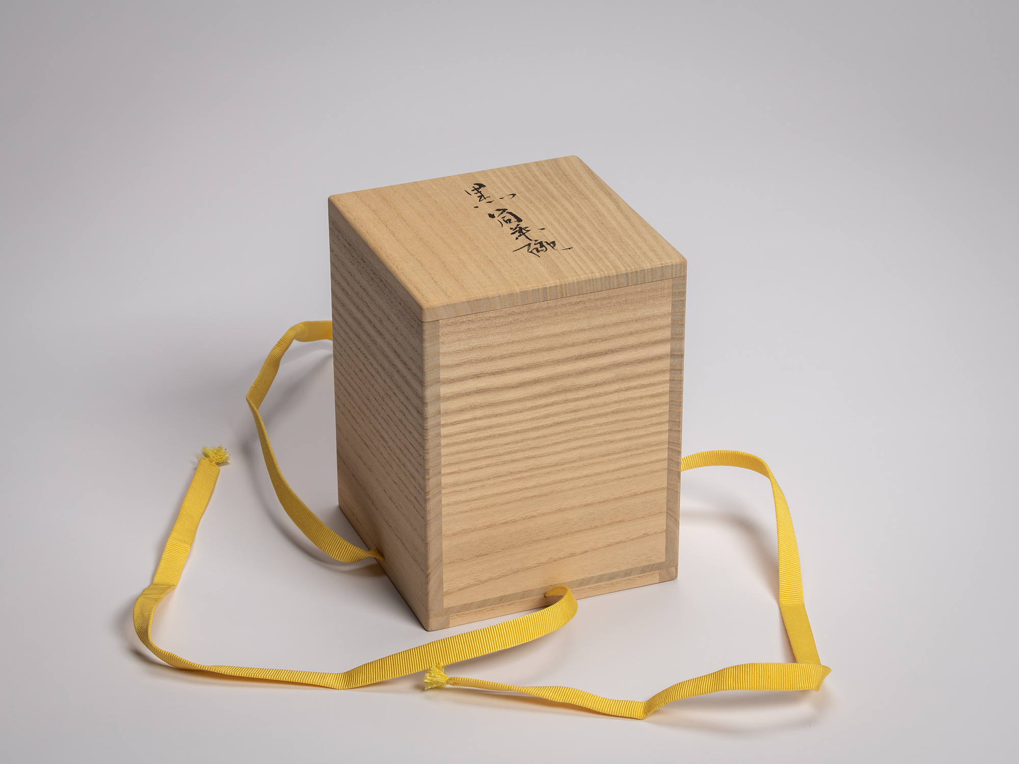 Tall rectangular kiri wood exterior storage box with calligraphic inscription reading「木下闇」(Konoshitayami,...