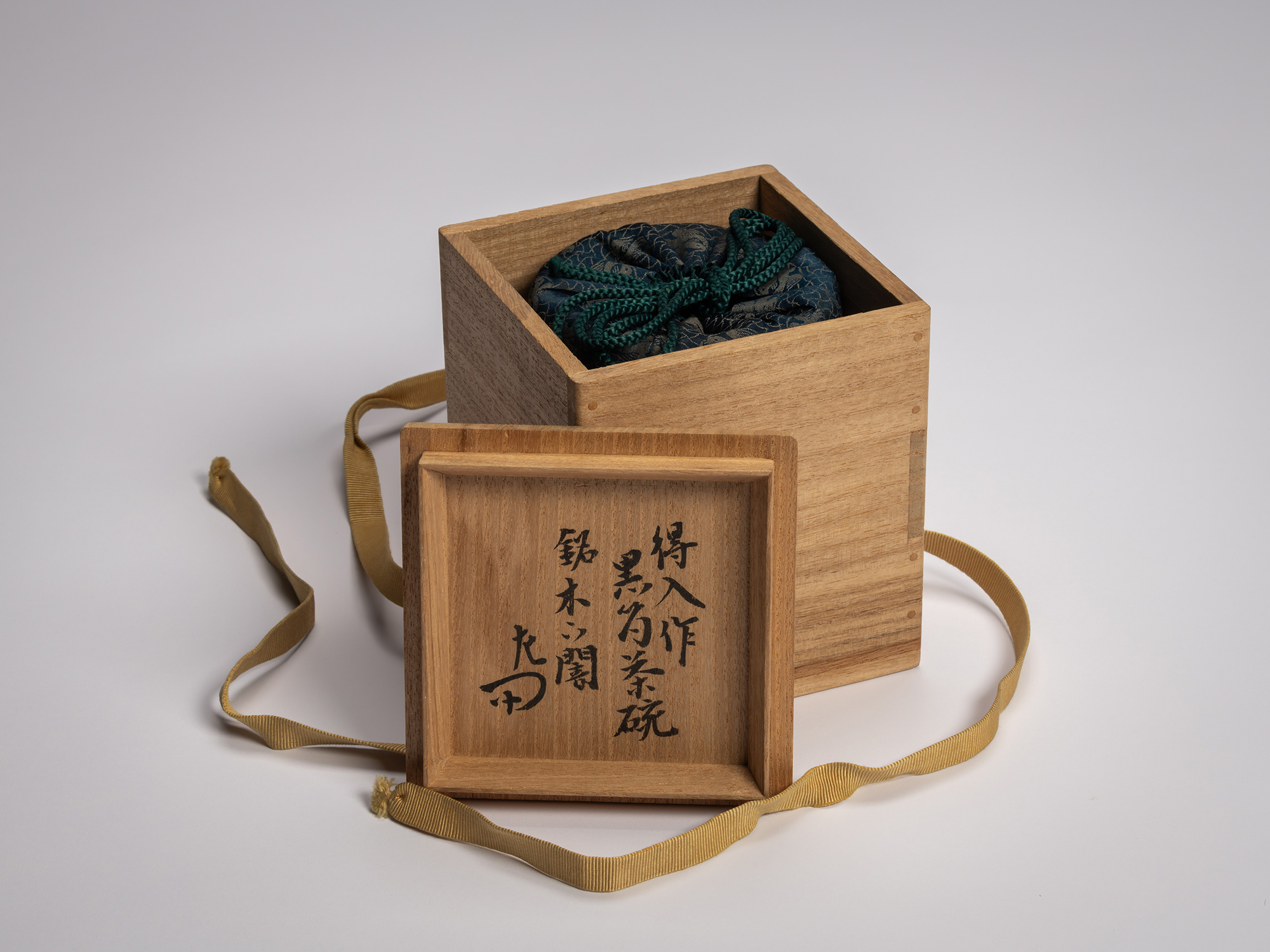 Interior lid of wooden tomobako (artist storage box) inscribed by Seisai XII in black calligraphy...