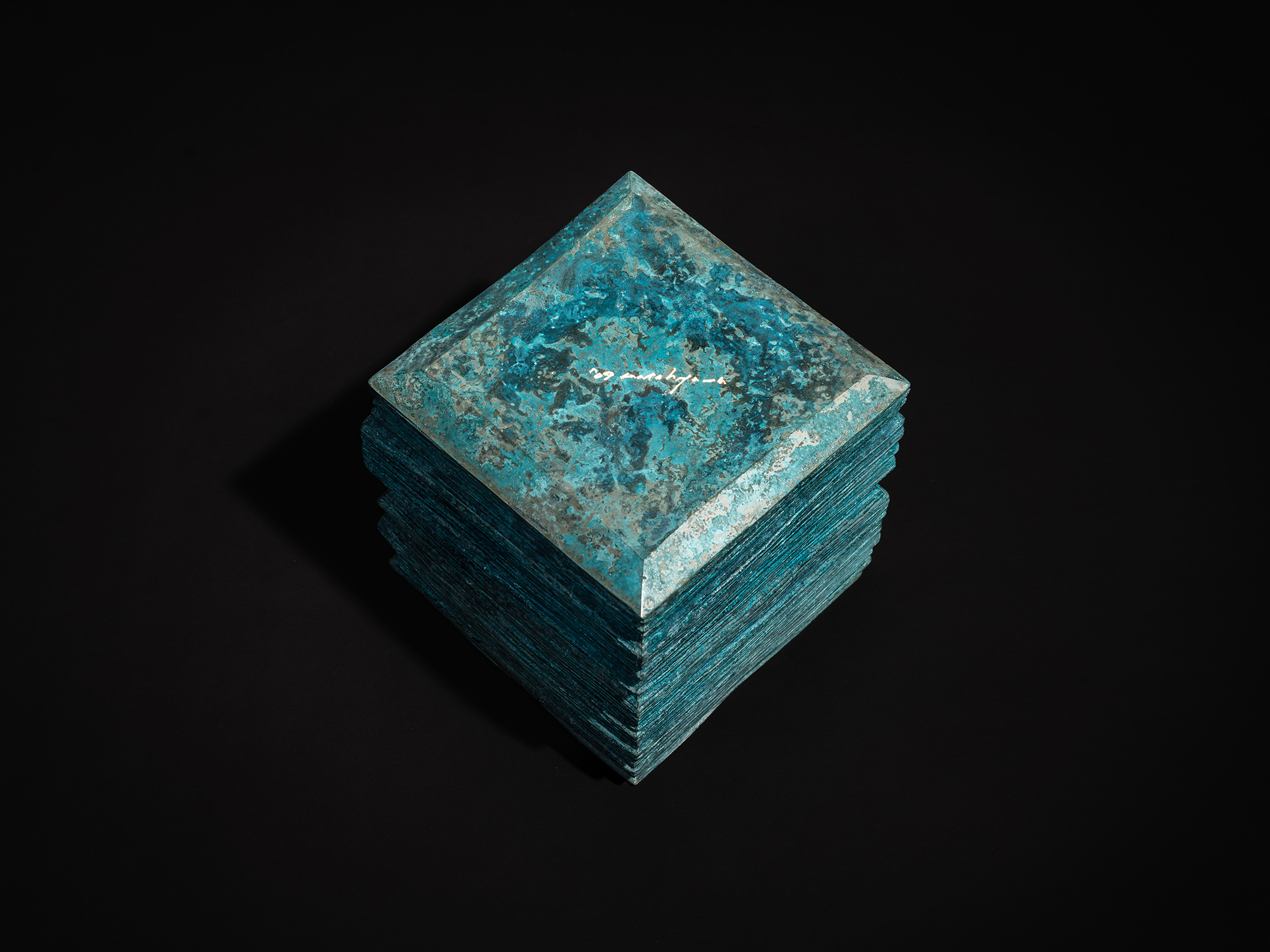 Bottom view of the bronze box Square Strips by Koji Hatakeyama, showing a square base with chamfered...